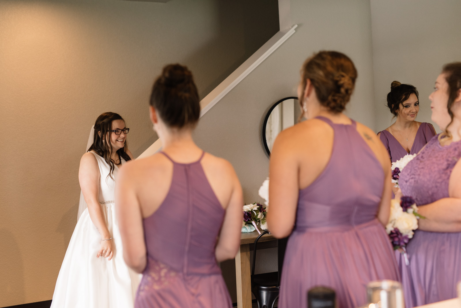 bride reaction first look with bridesmaids