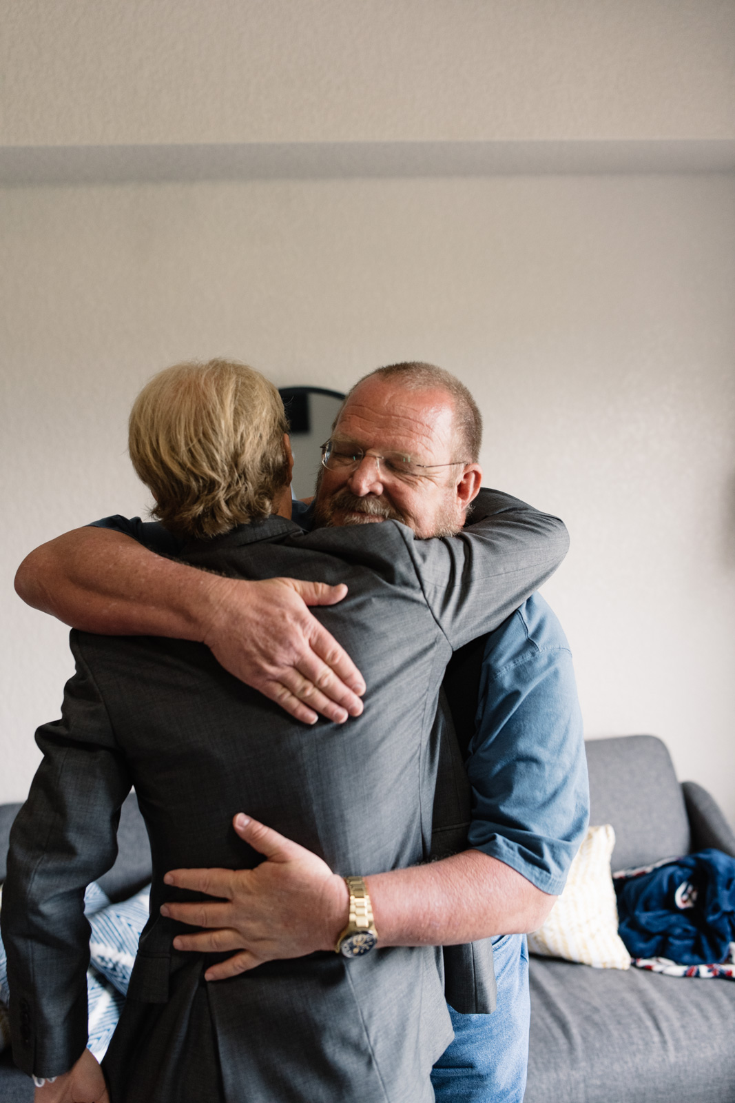 groom hugging dad iowa wedding