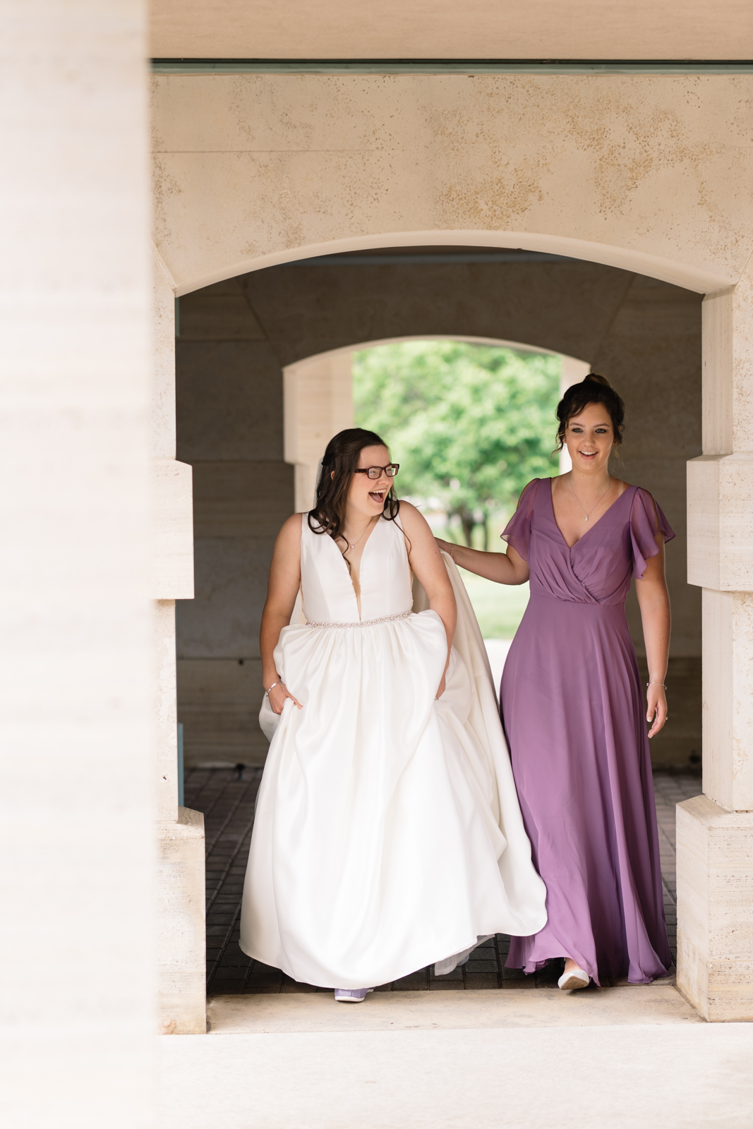 maid of honor walking with bride first look wartburg college wedding