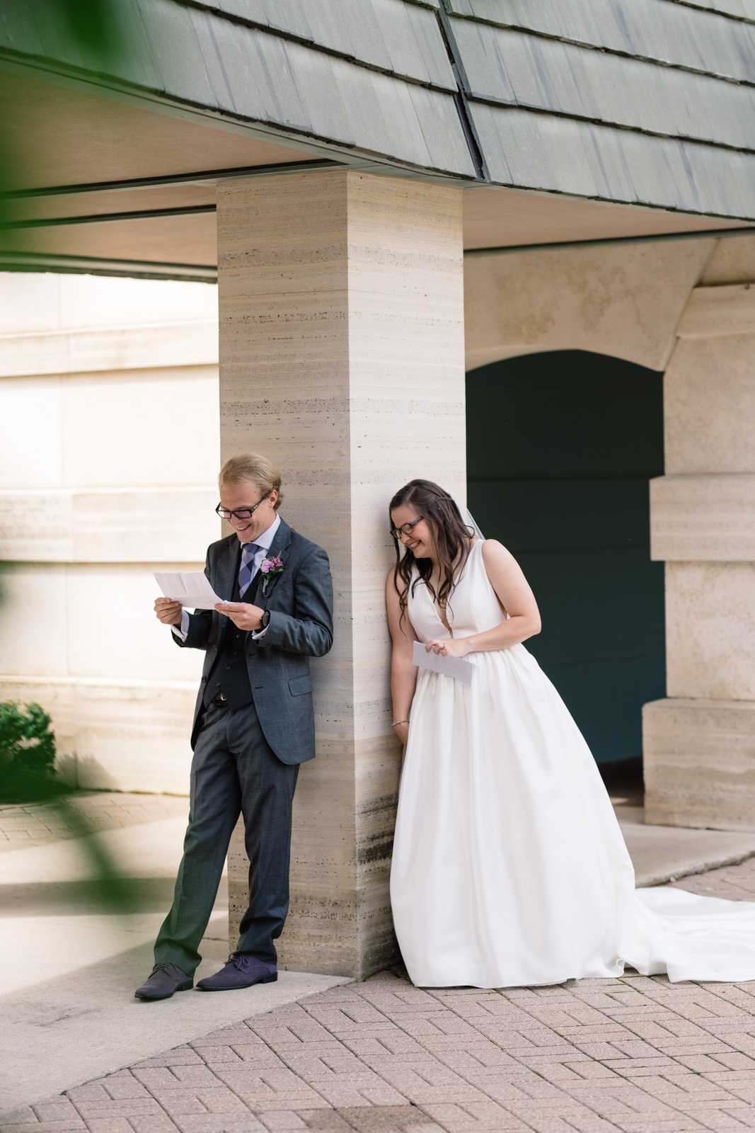 bride and groom reading letters wartburg college wedding