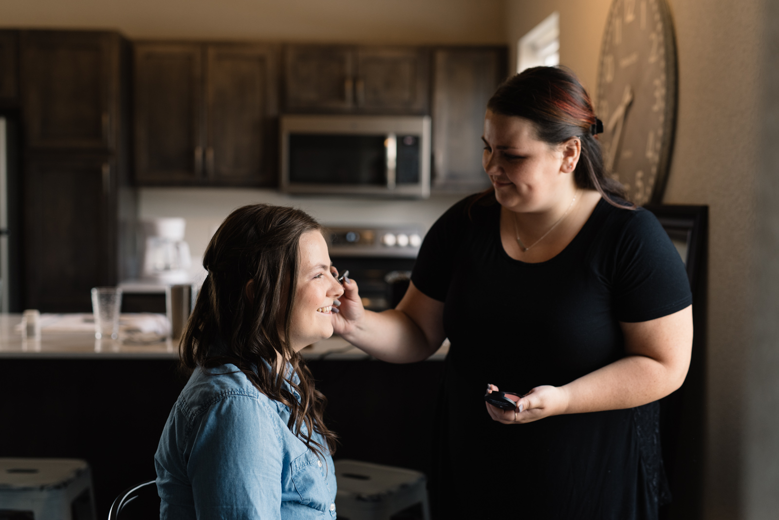 bride getting make up done iowa wedding