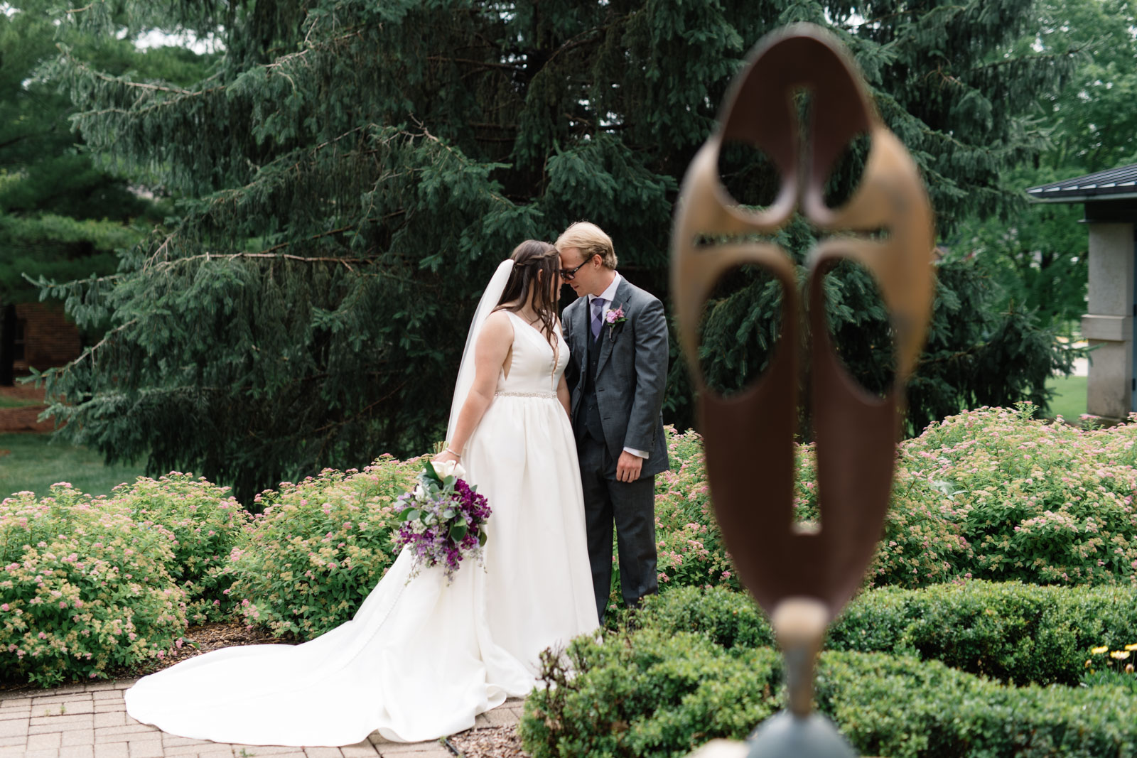 bride and groom in courtyard at wartburg college wedding