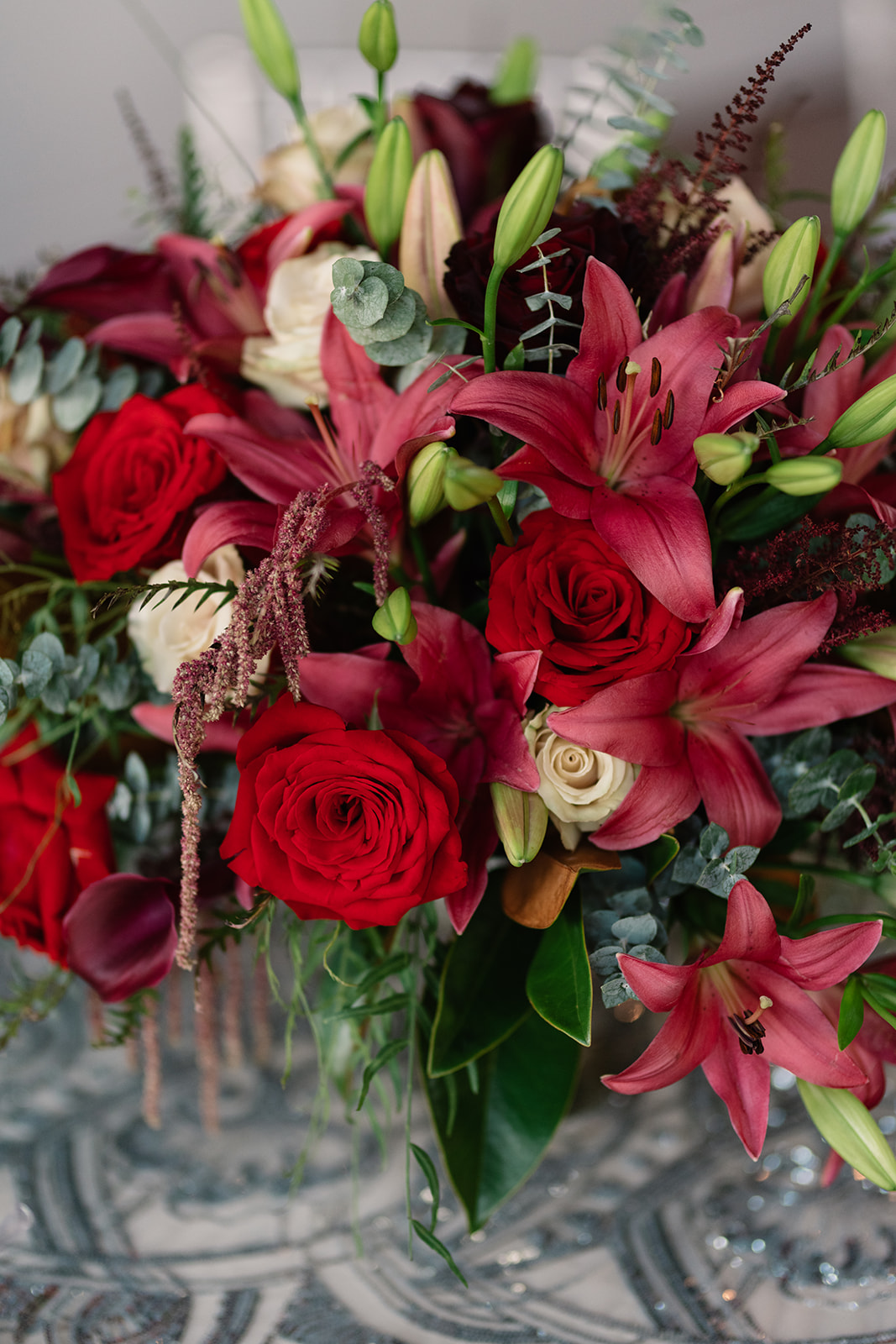 red and pink floral bouquet olympic south side theater wedding venue cedar rapids