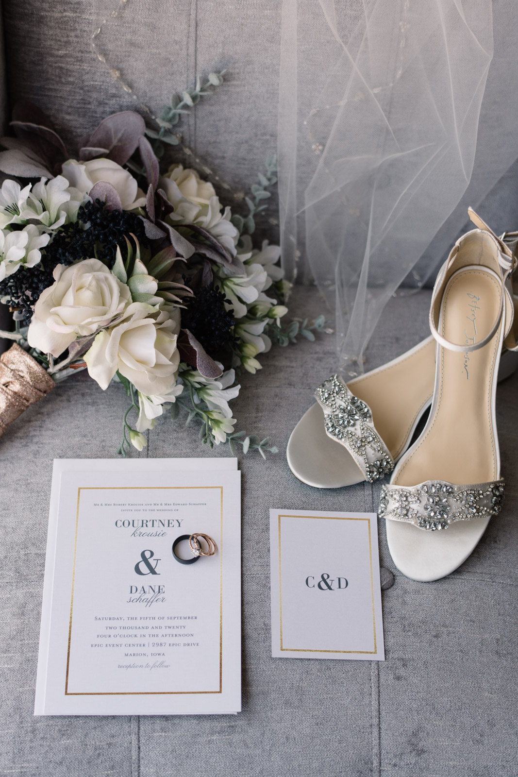 wedding shoes bouquet invitations and veil on chair