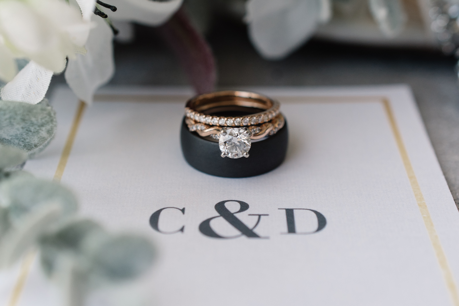 wedding rings with monogrammed invitations