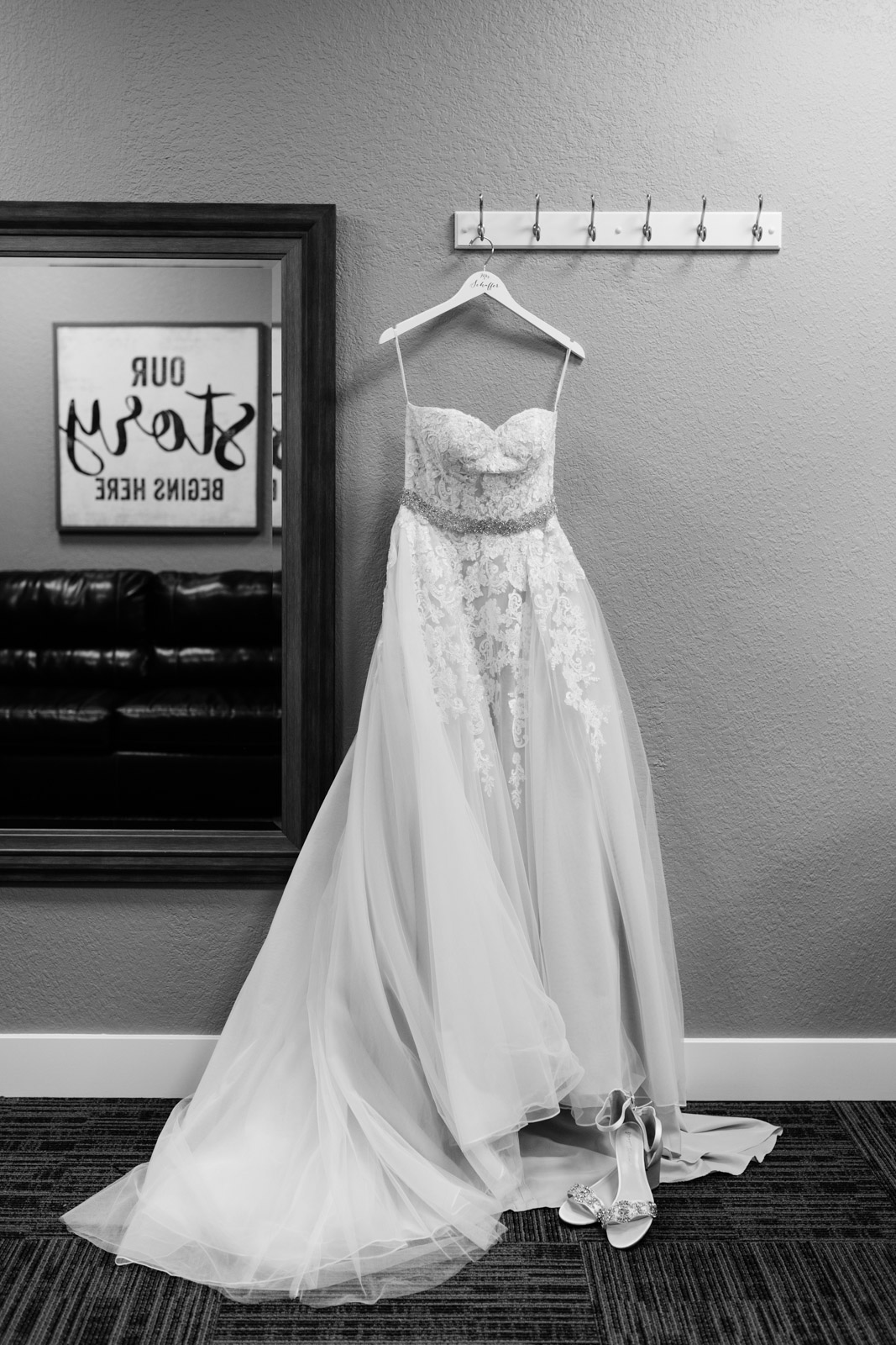 wedding dress hanging on wall epic event center wedding venue