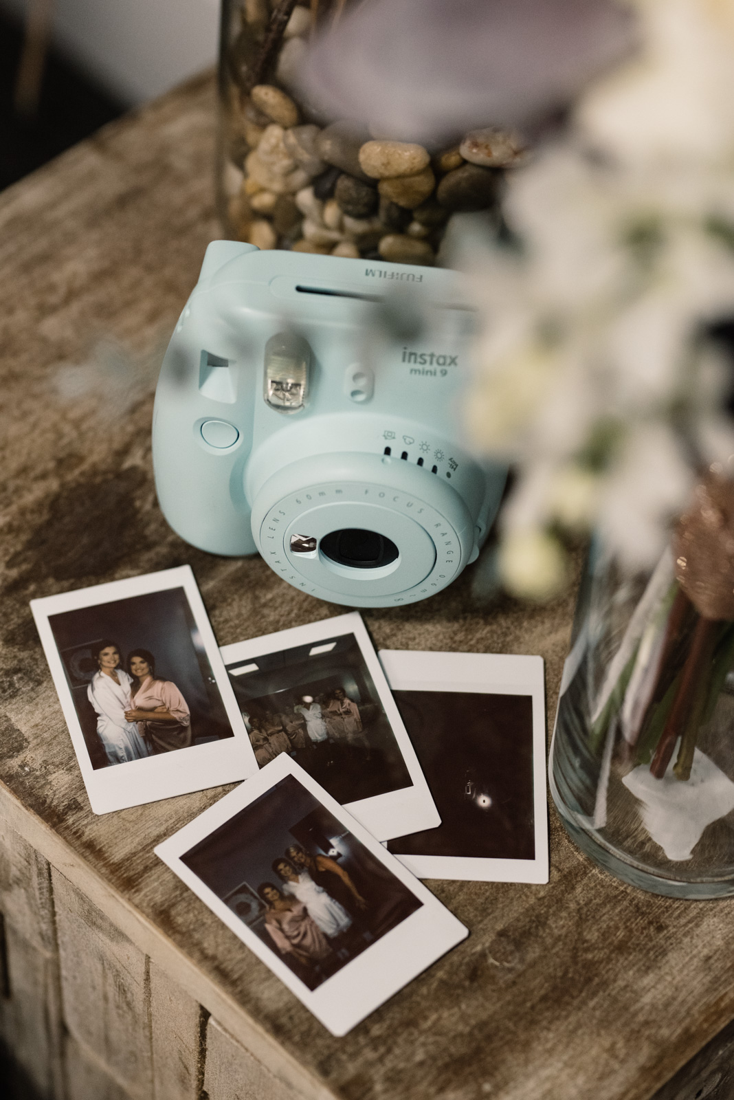 polaroid camera with wedding bouquet epic event center