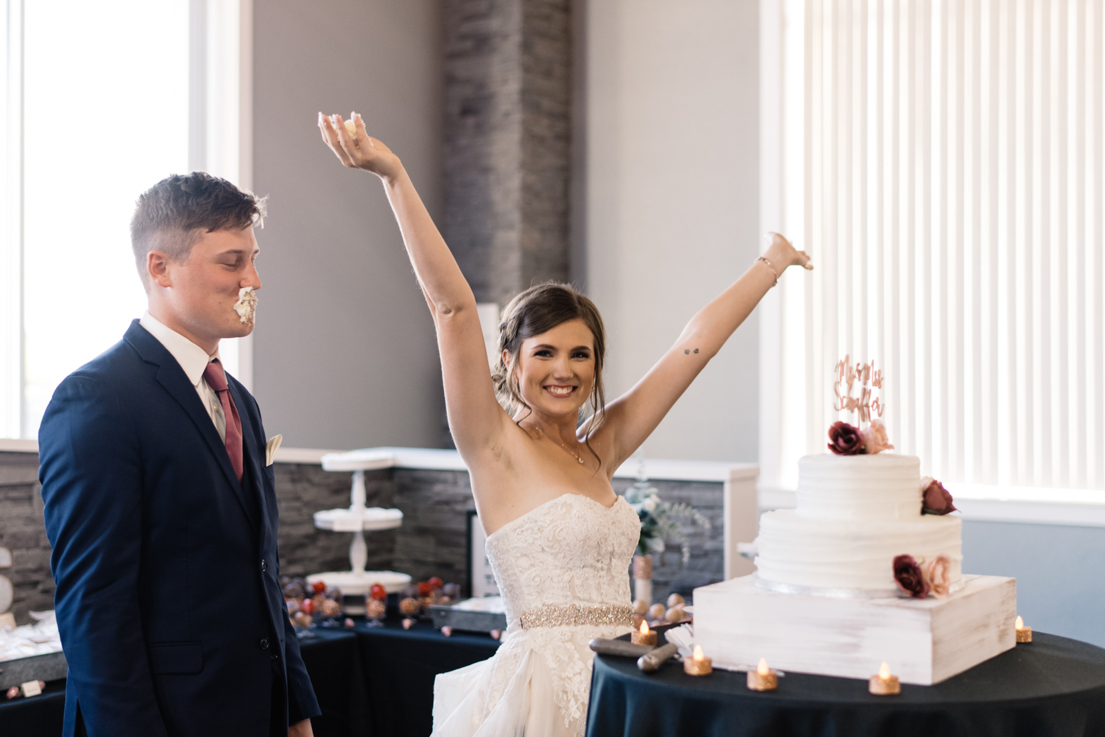 bride and groom cake smash cedar rapids wedding venue