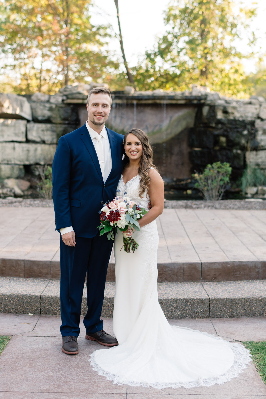 bride and groom outside at bella sala wedding venue in tiffin iowa