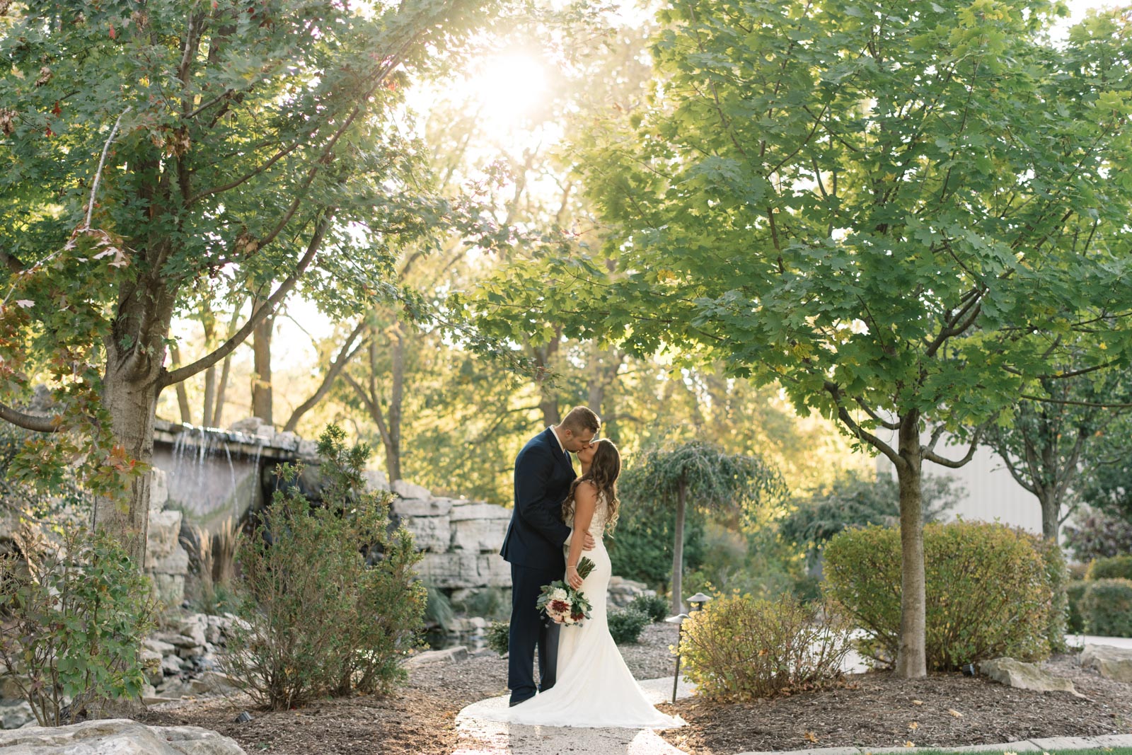 bride and groom outside at bella sala wedding venue in tiffin iowa