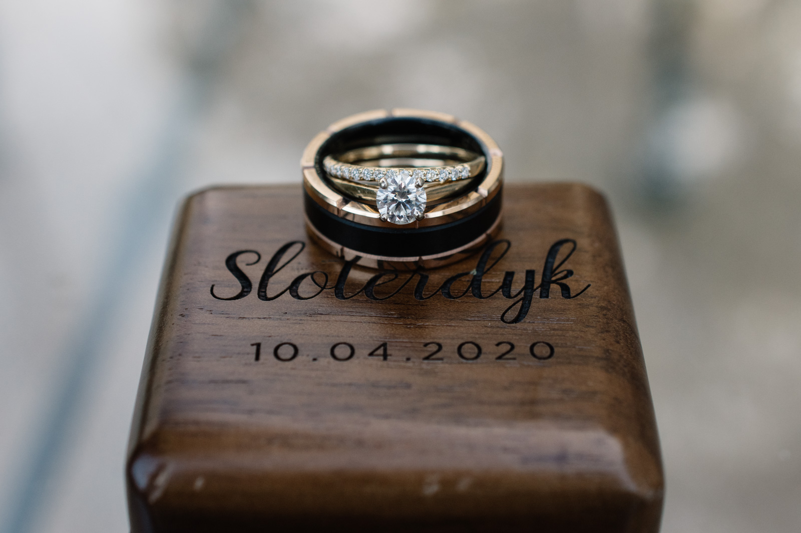 wedding rings on custom carved wood box bella sala weddings in tiffin iowa