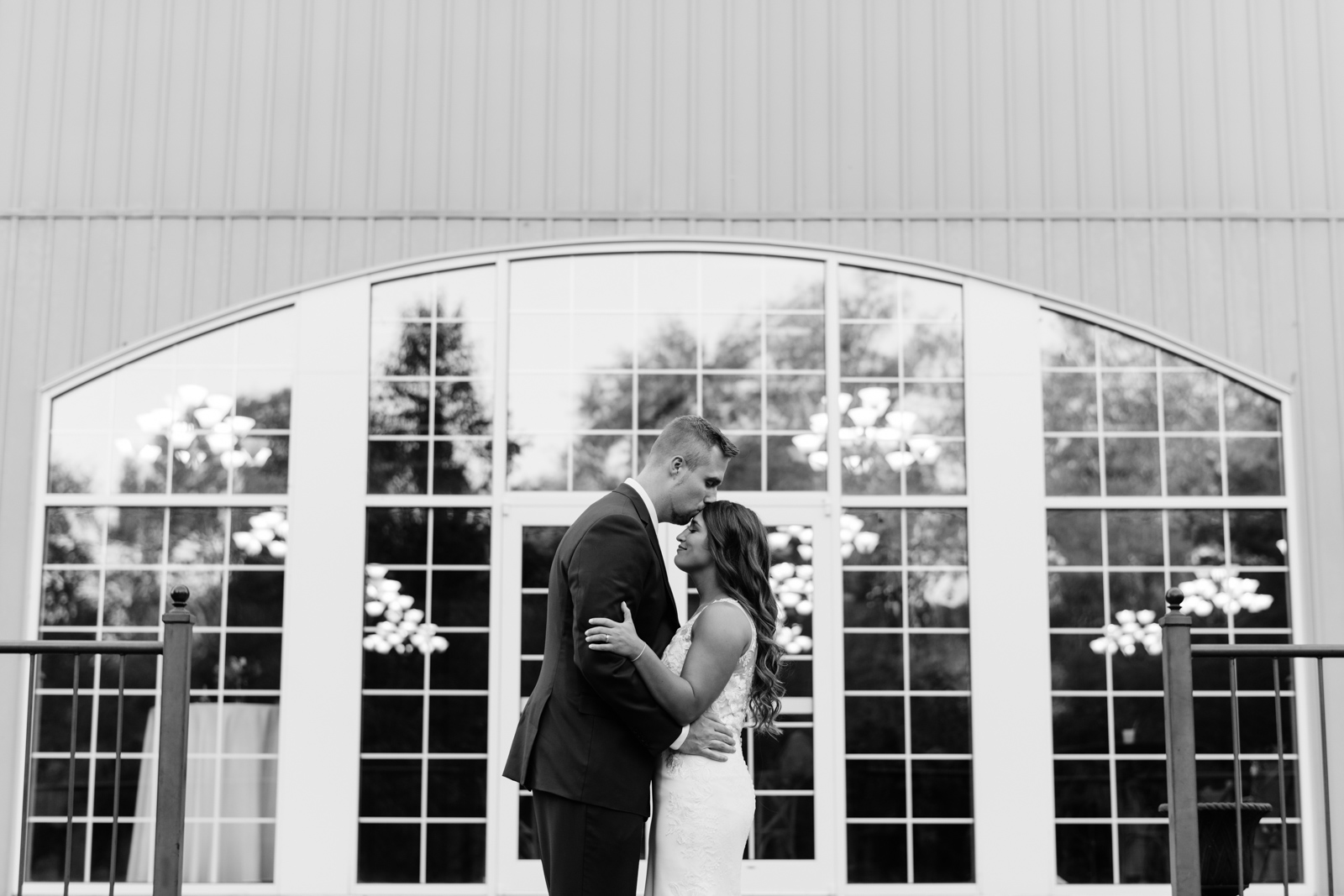 bride and groom outside at bella sala wedding venue in tiffin iowa