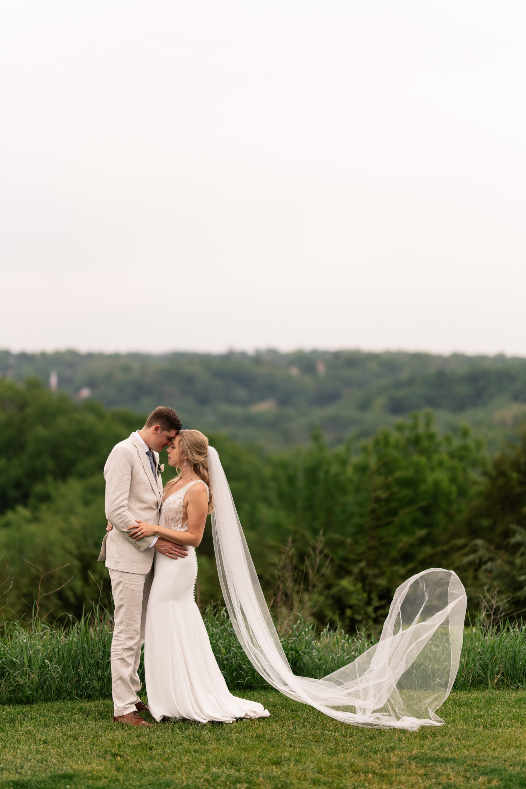 couple under twinkly light wedding arch brick wall olympic south side theater wedding venue cedar rapids