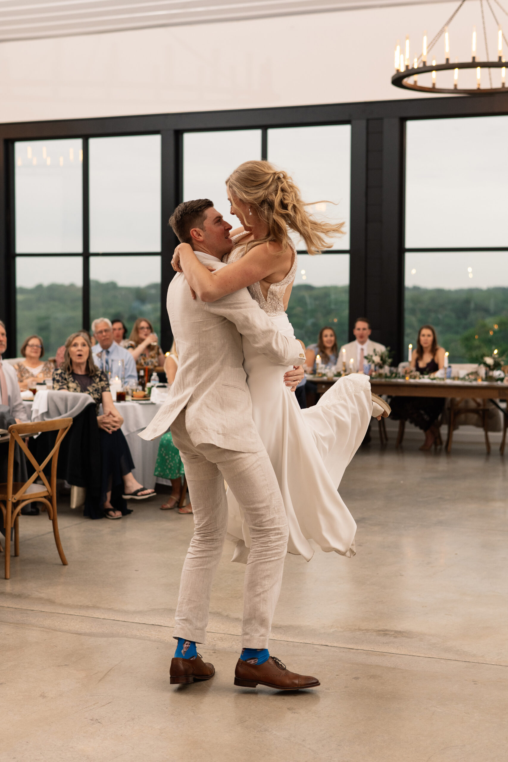 couple under twinkly light wedding arch brick wall olympic south side theater wedding venue cedar rapids