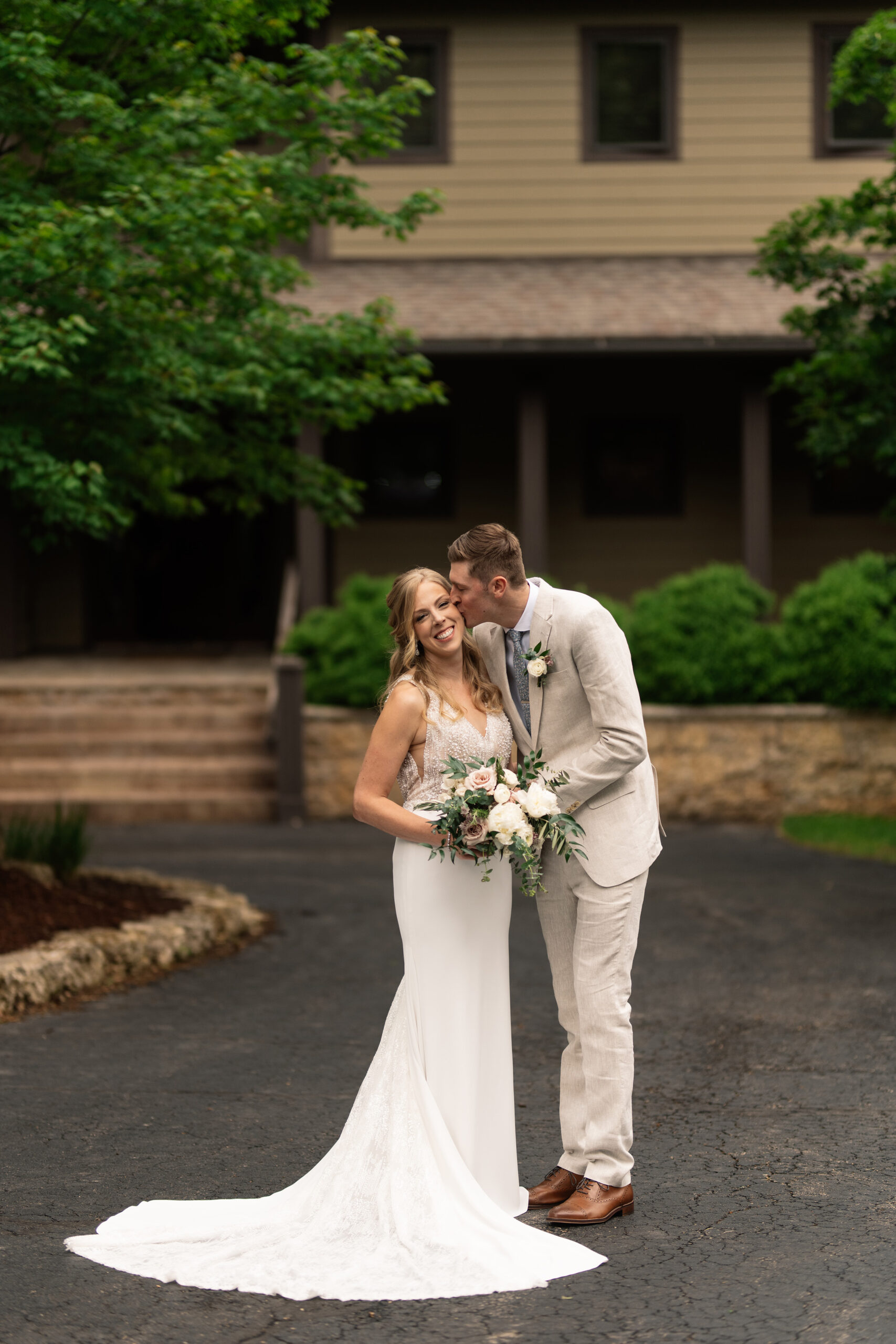 couple under twinkly light wedding arch brick wall olympic south side theater wedding venue cedar rapids