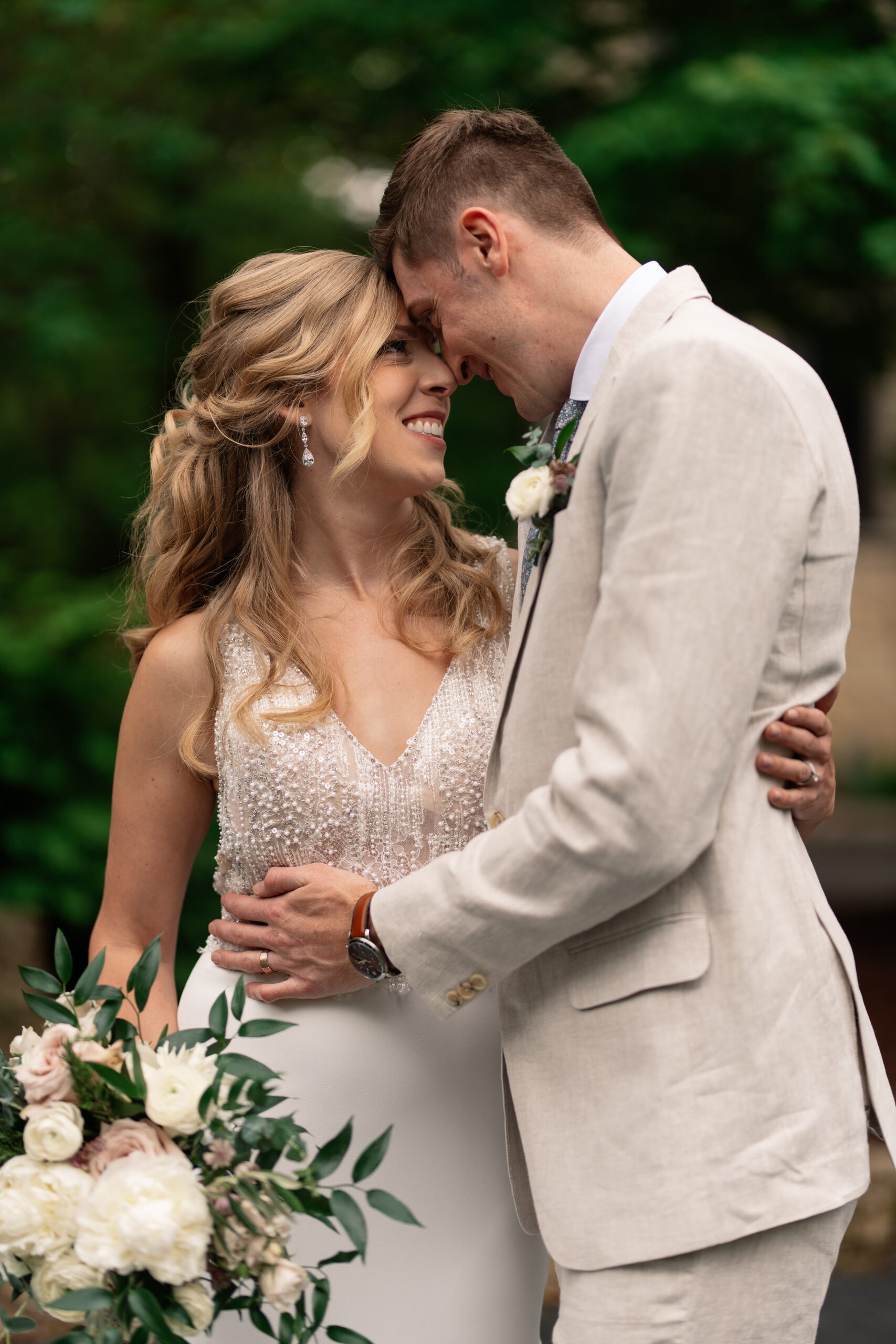 couple under twinkly light wedding arch brick wall olympic south side theater wedding venue cedar rapids