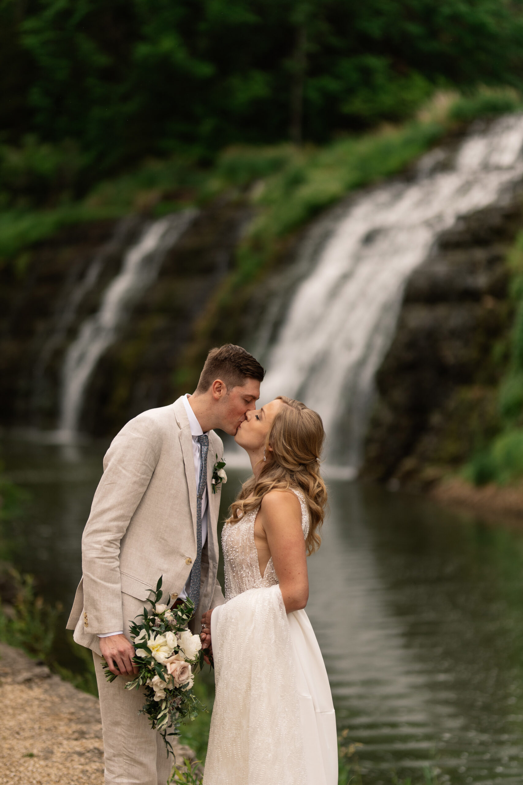 couple under twinkly light wedding arch brick wall olympic south side theater wedding venue cedar rapids