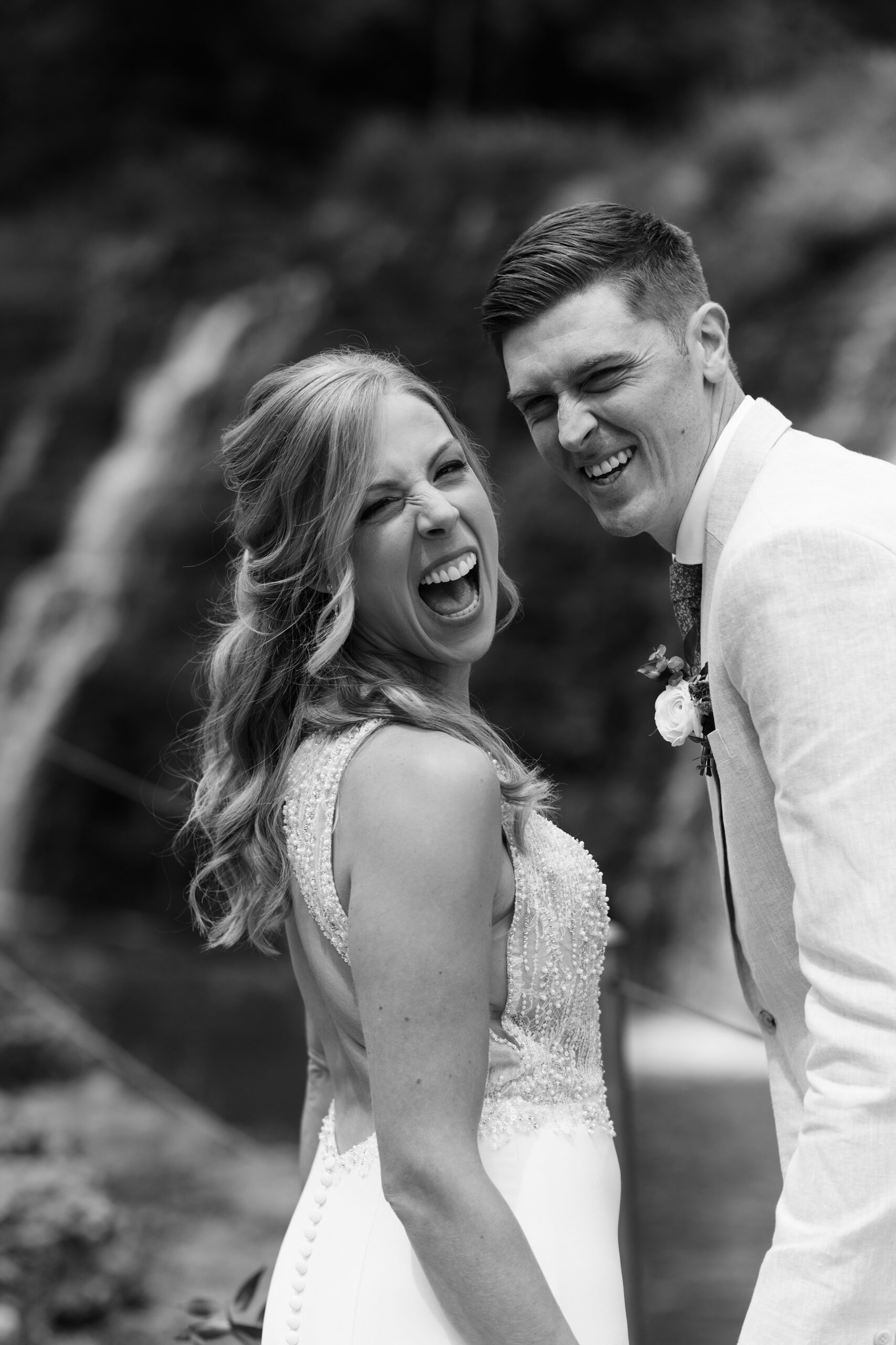 couple under twinkly light wedding arch brick wall olympic south side theater wedding venue cedar rapids