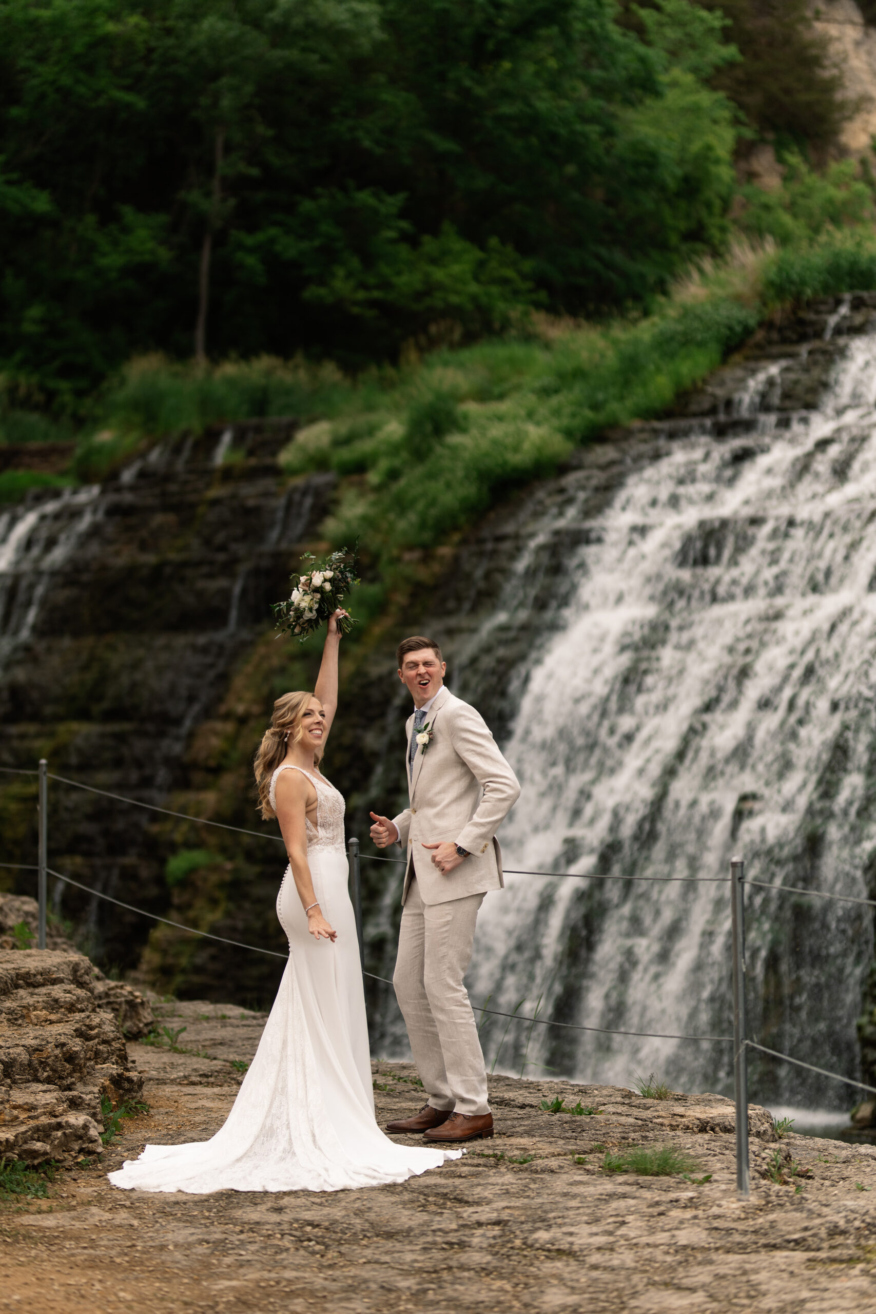 couple under twinkly light wedding arch brick wall olympic south side theater wedding venue cedar rapids