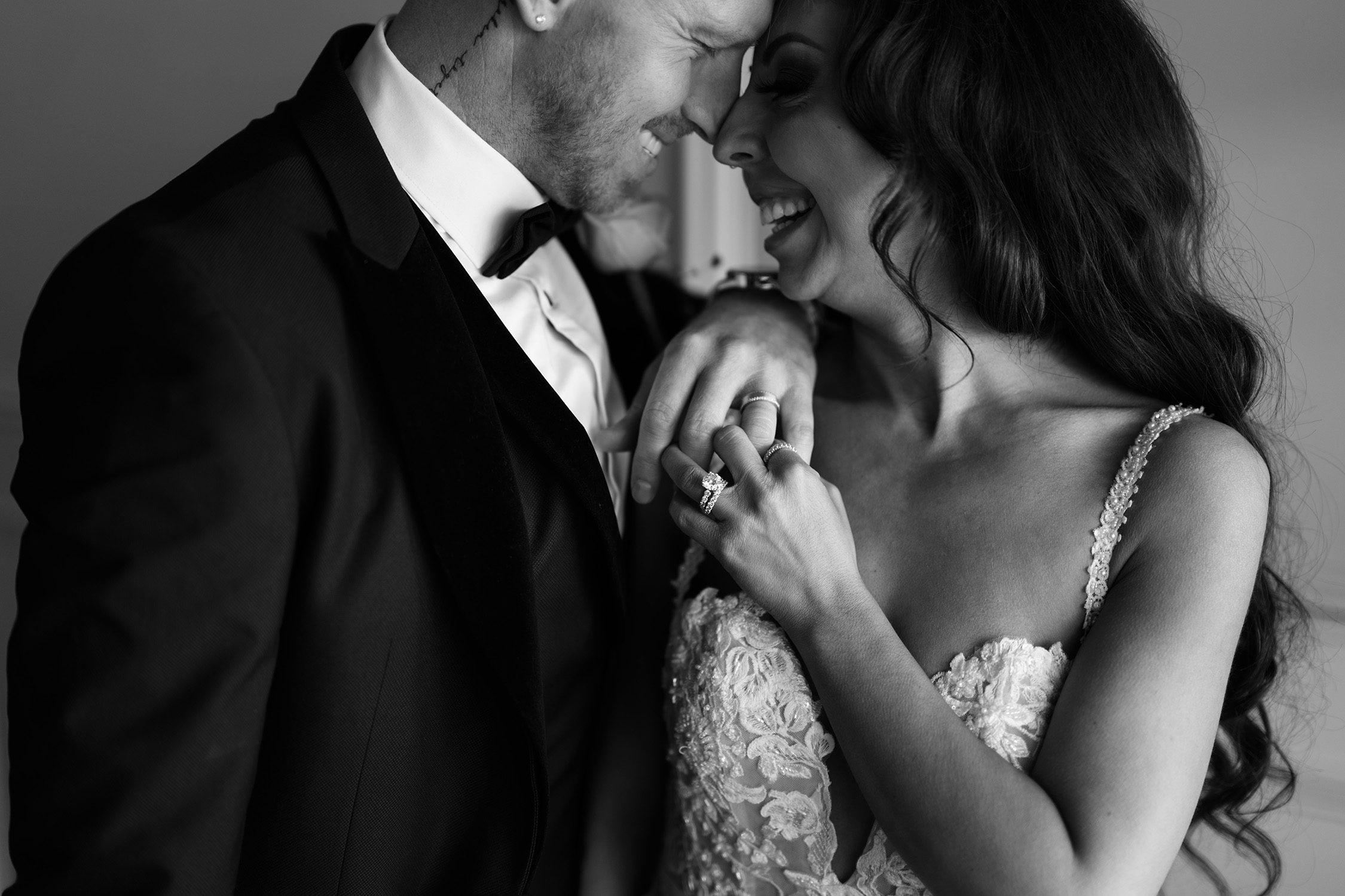 couple under twinkly light wedding arch brick wall olympic south side theater wedding venue cedar rapids