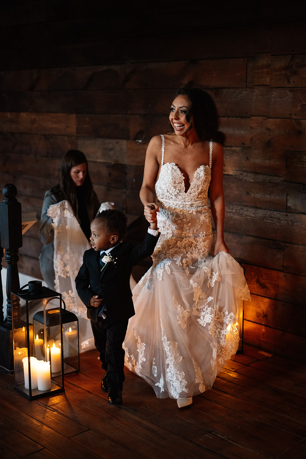 couple under twinkly light wedding arch brick wall olympic south side theater wedding venue cedar rapids