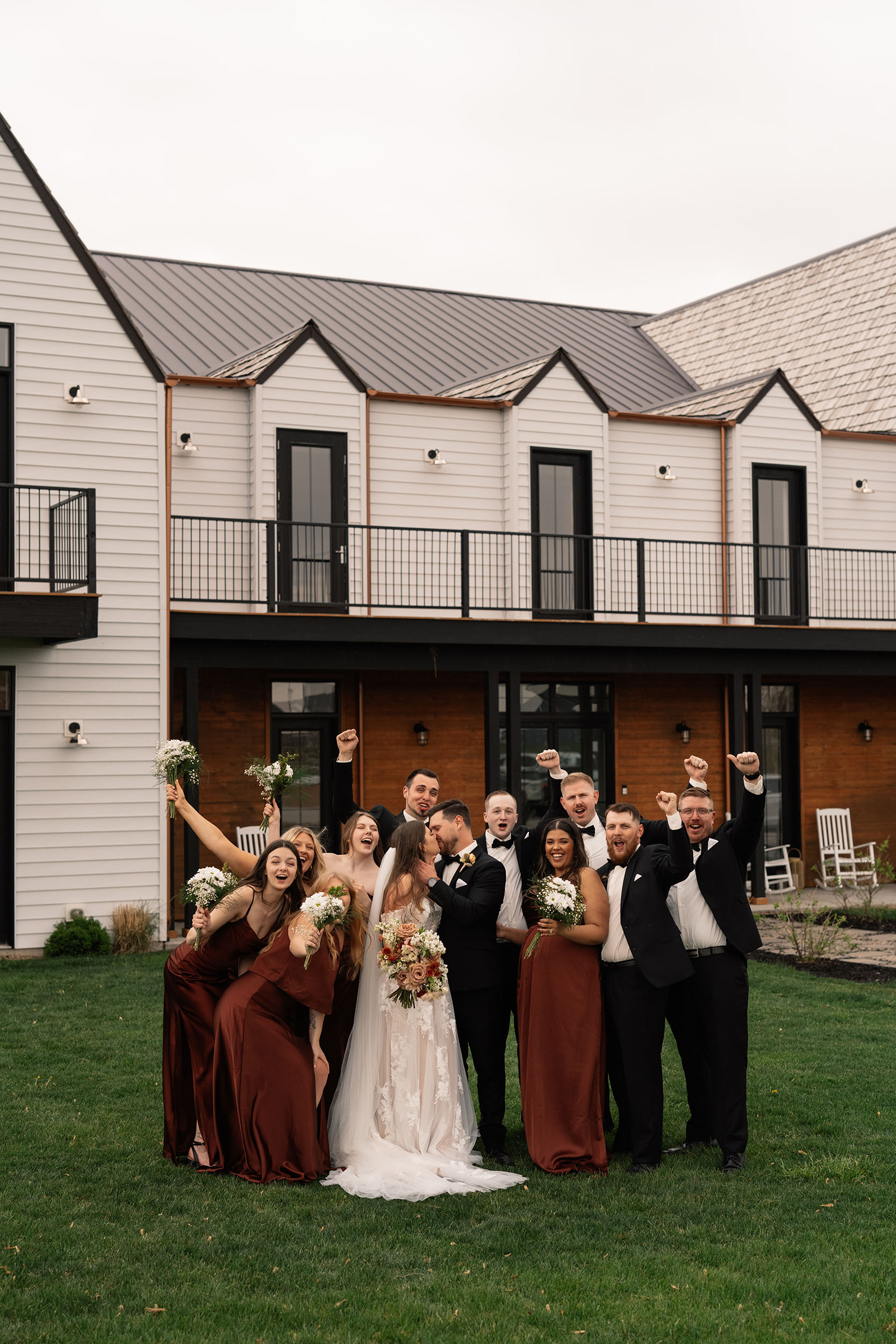 couple under twinkly light wedding arch brick wall olympic south side theater wedding venue cedar rapids