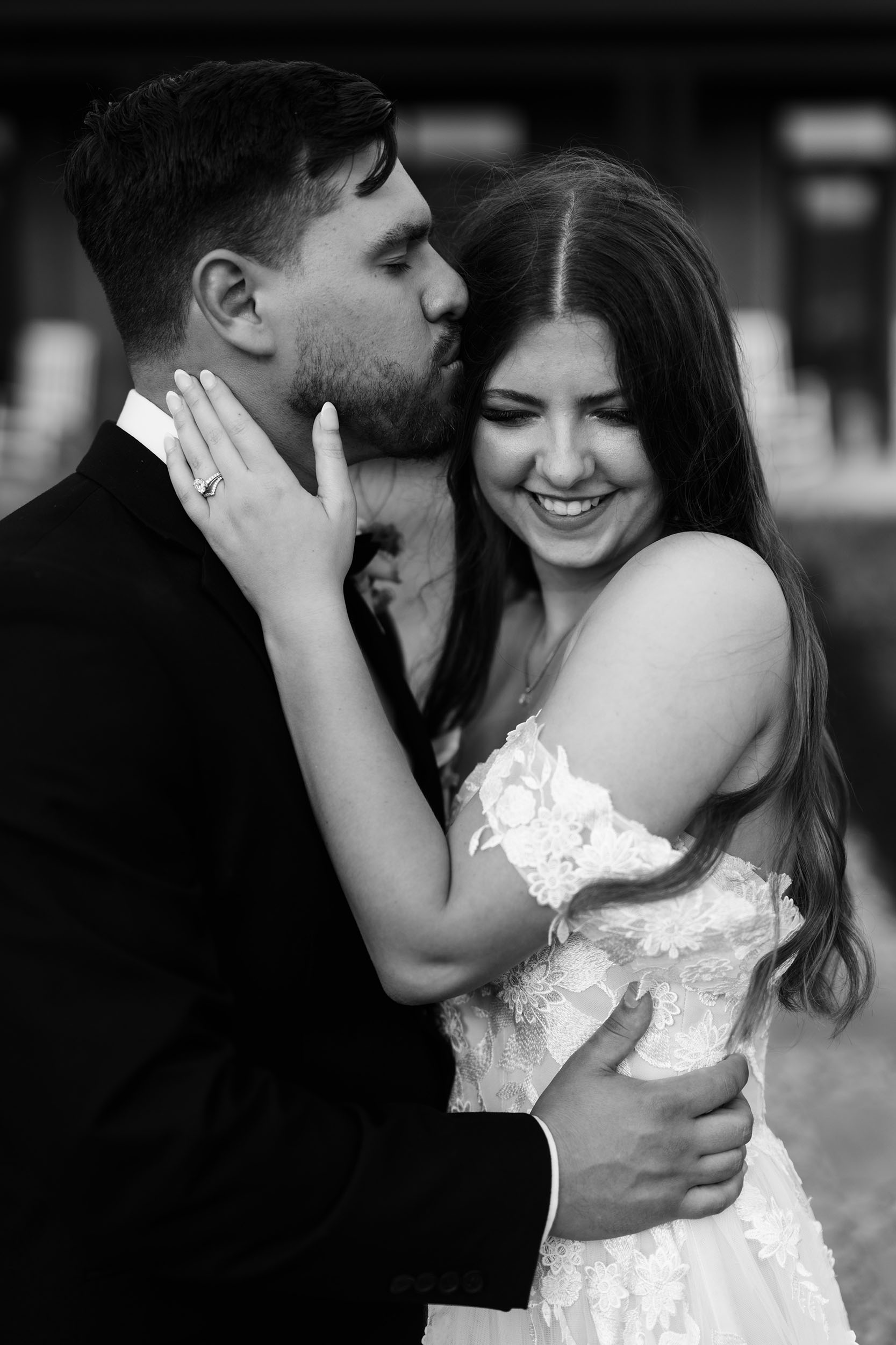 couple under twinkly light wedding arch brick wall olympic south side theater wedding venue cedar rapids