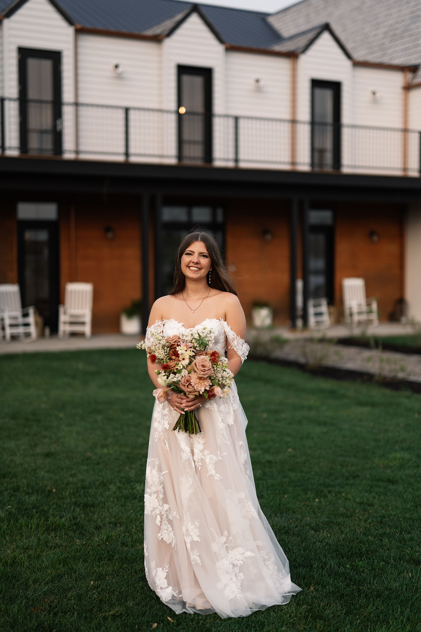 couple under twinkly light wedding arch brick wall olympic south side theater wedding venue cedar rapids