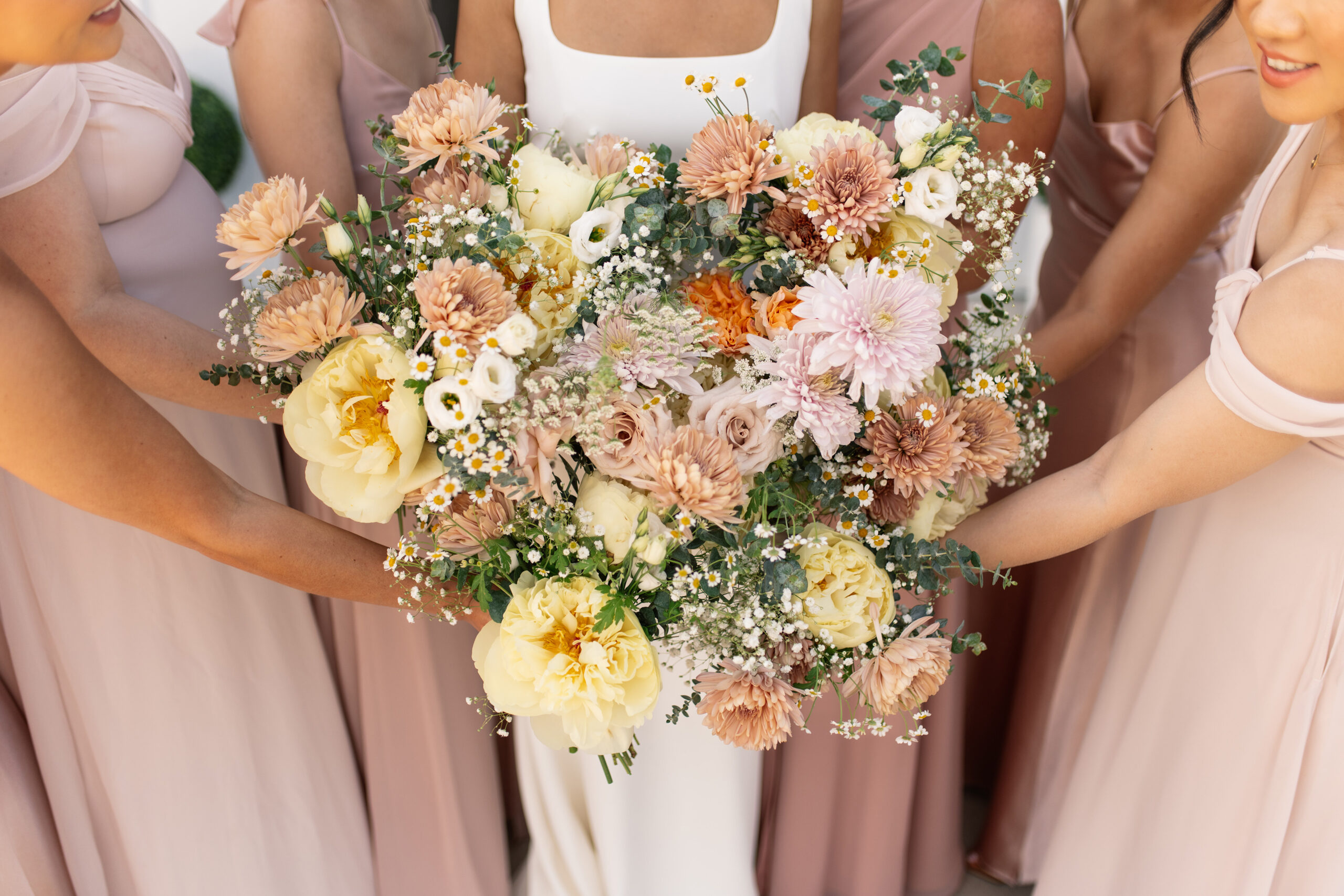 red and pink floral bouquet olympic south side theater wedding venue cedar rapids