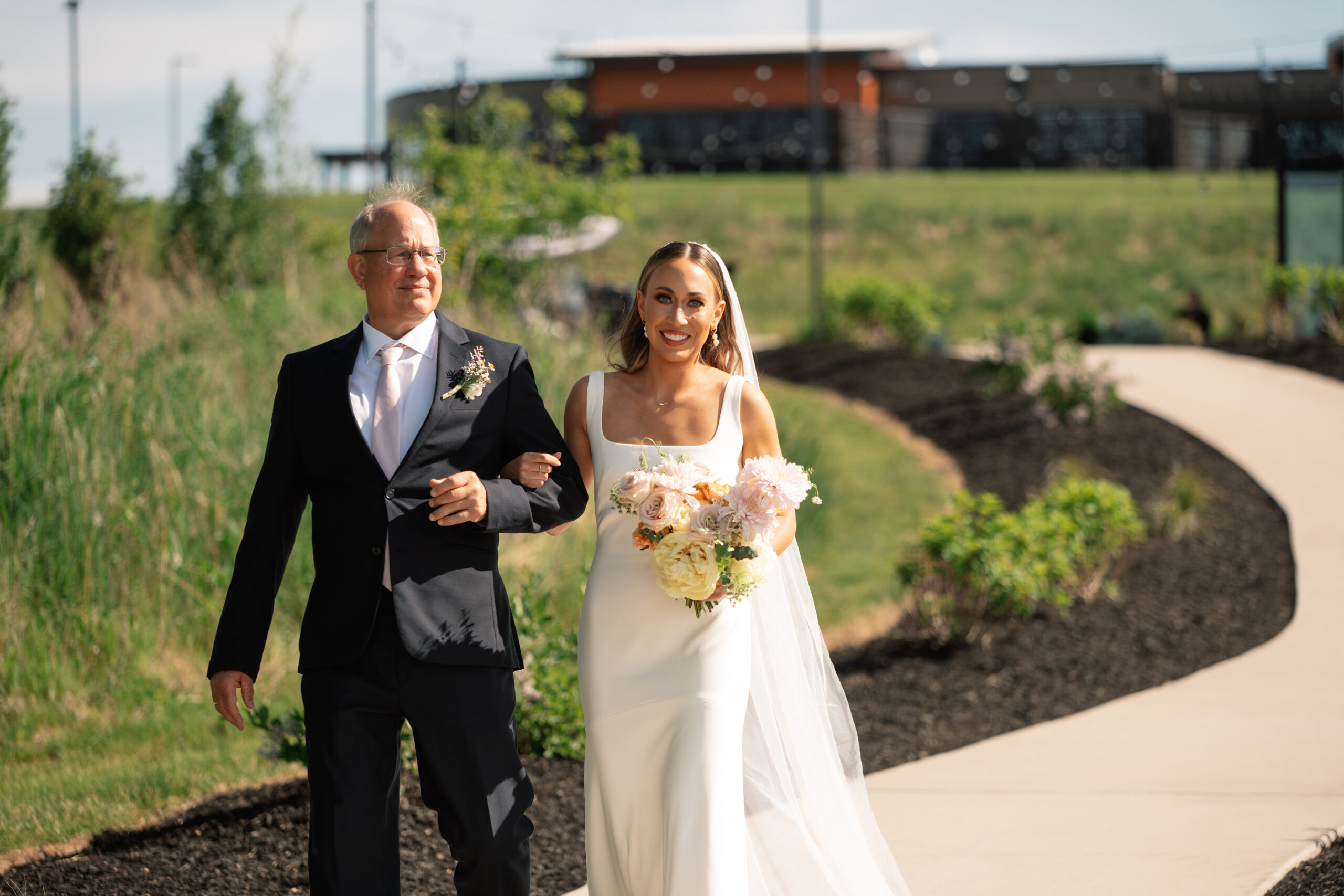 red and pink floral bouquet olympic south side theater wedding venue cedar rapids