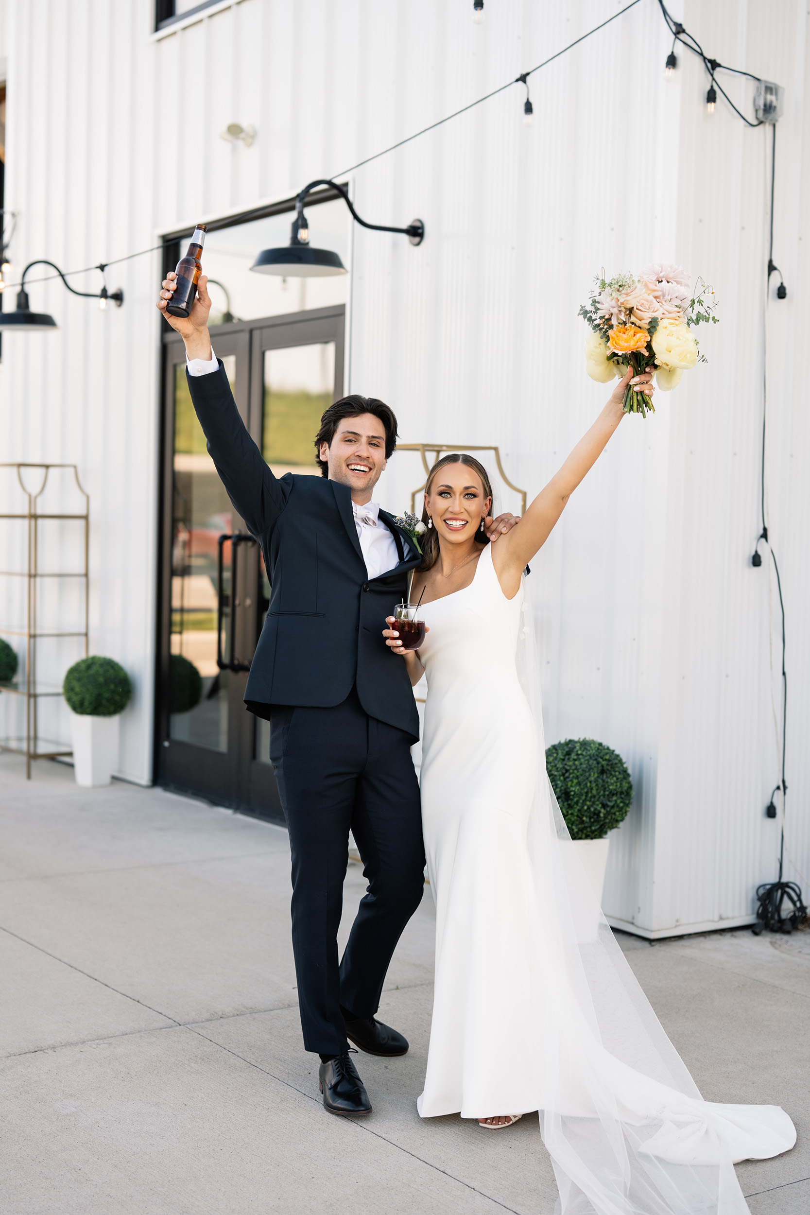 red and pink floral bouquet olympic south side theater wedding venue cedar rapids