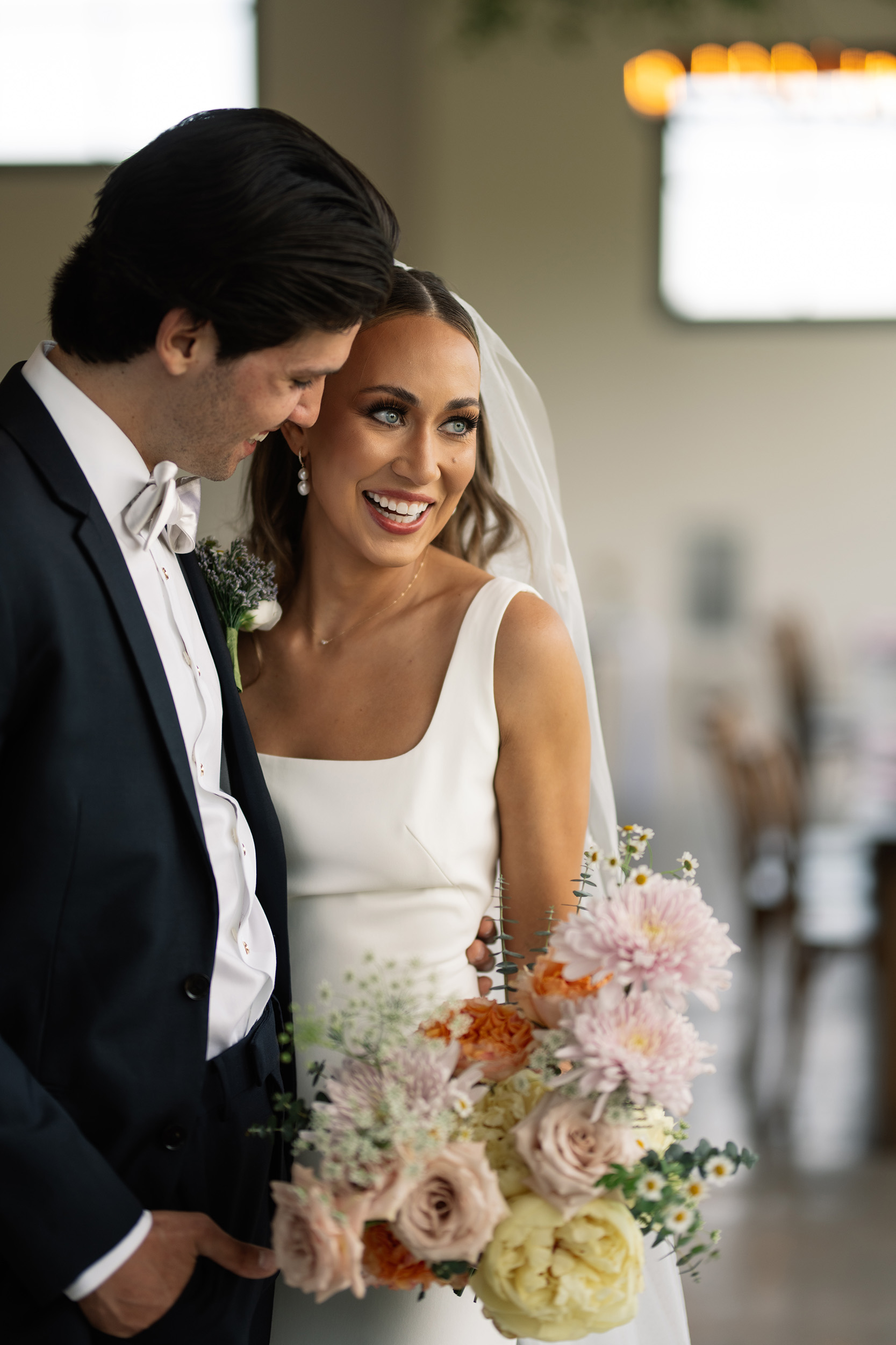 red and pink floral bouquet olympic south side theater wedding venue cedar rapids