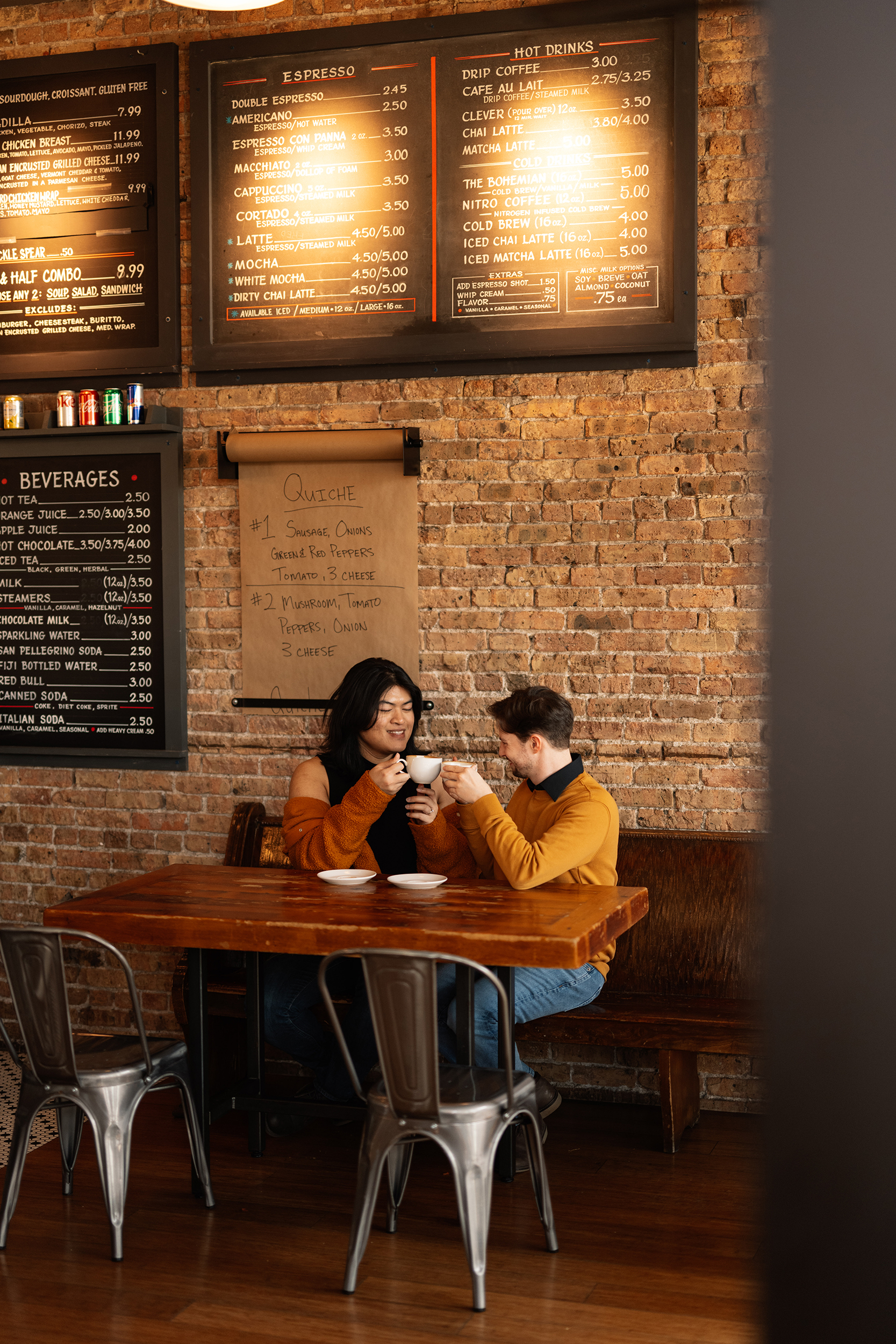 couple under twinkly light wedding arch brick wall olympic south side theater wedding venue cedar rapids