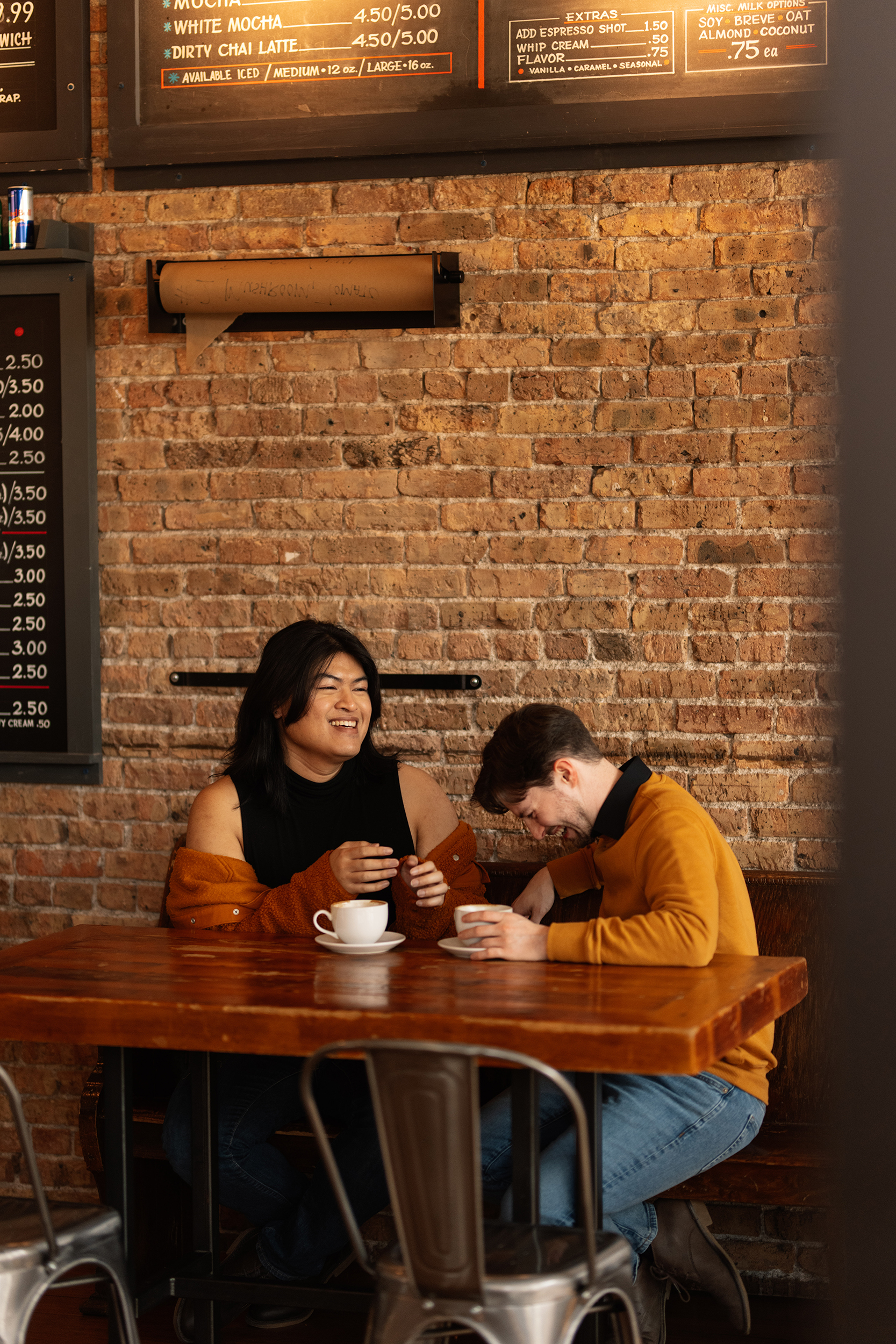 couple under twinkly light wedding arch brick wall olympic south side theater wedding venue cedar rapids