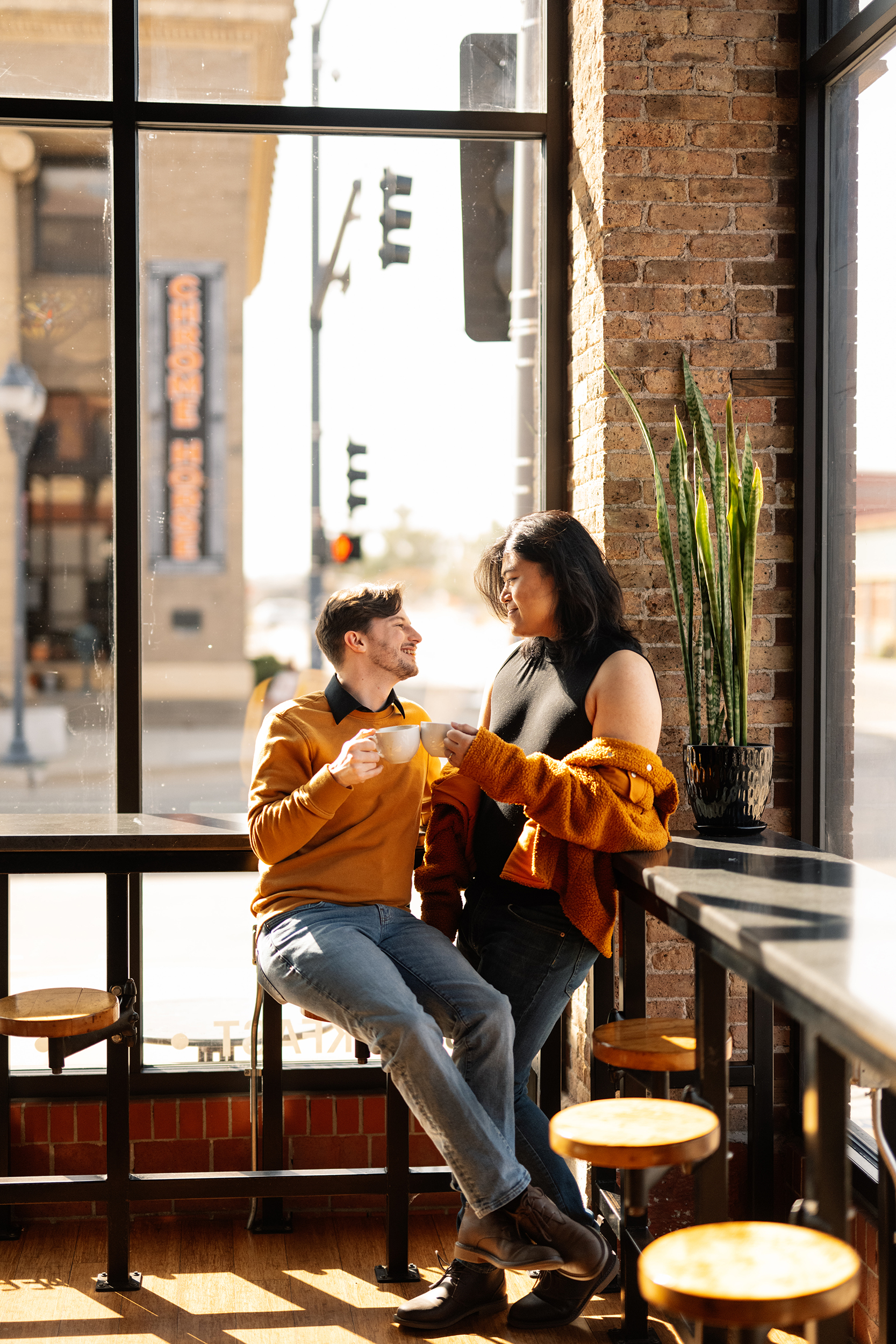 couple under twinkly light wedding arch brick wall olympic south side theater wedding venue cedar rapids