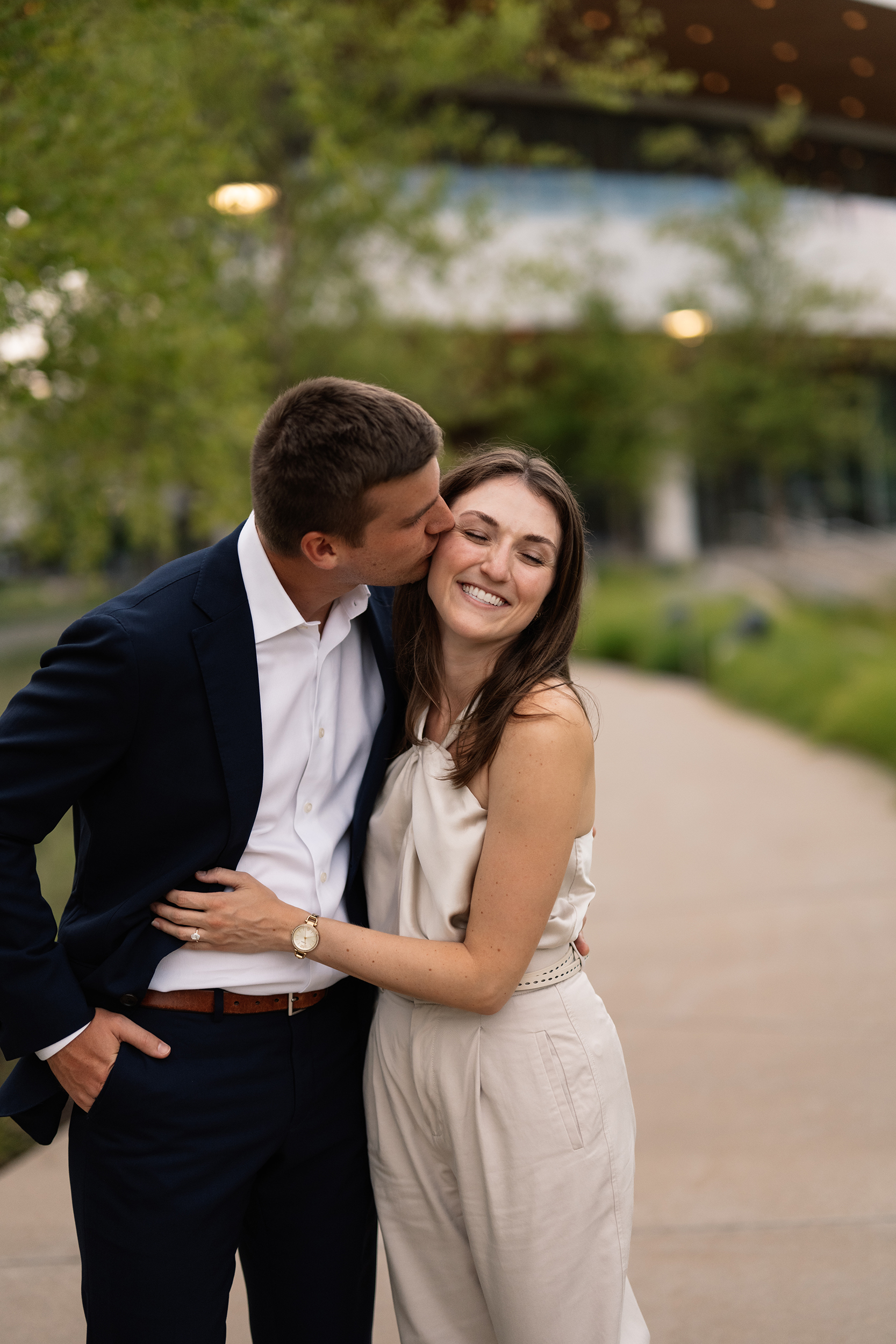 couple under twinkly light wedding arch brick wall olympic south side theater wedding venue cedar rapids