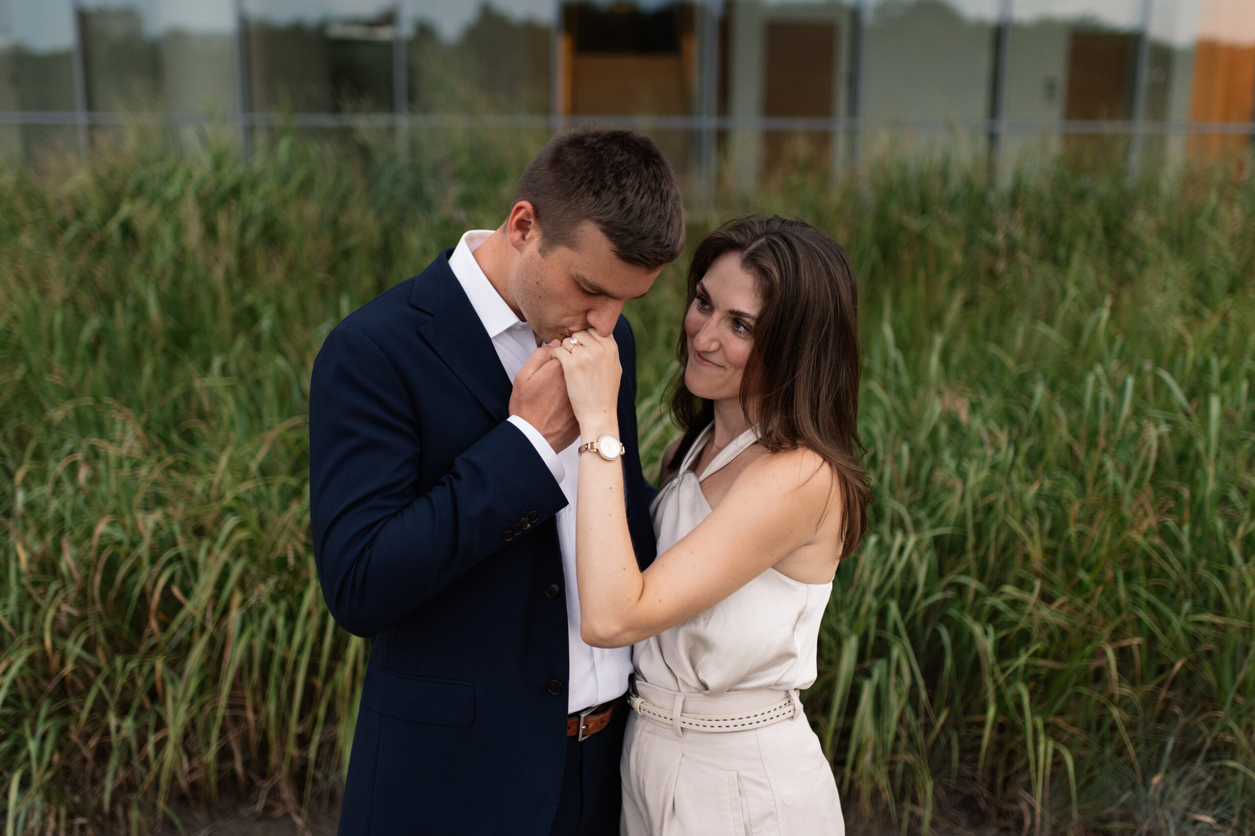 couple under twinkly light wedding arch brick wall olympic south side theater wedding venue cedar rapids