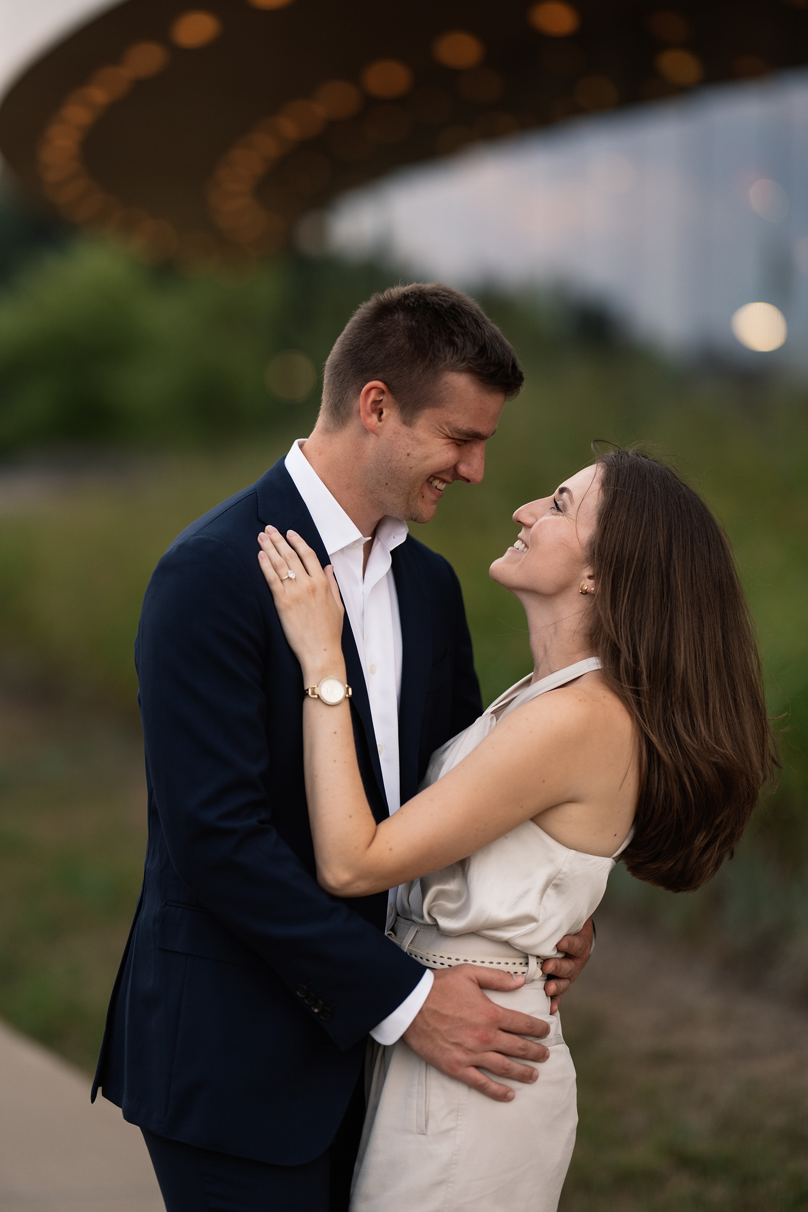 couple under twinkly light wedding arch brick wall olympic south side theater wedding venue cedar rapids