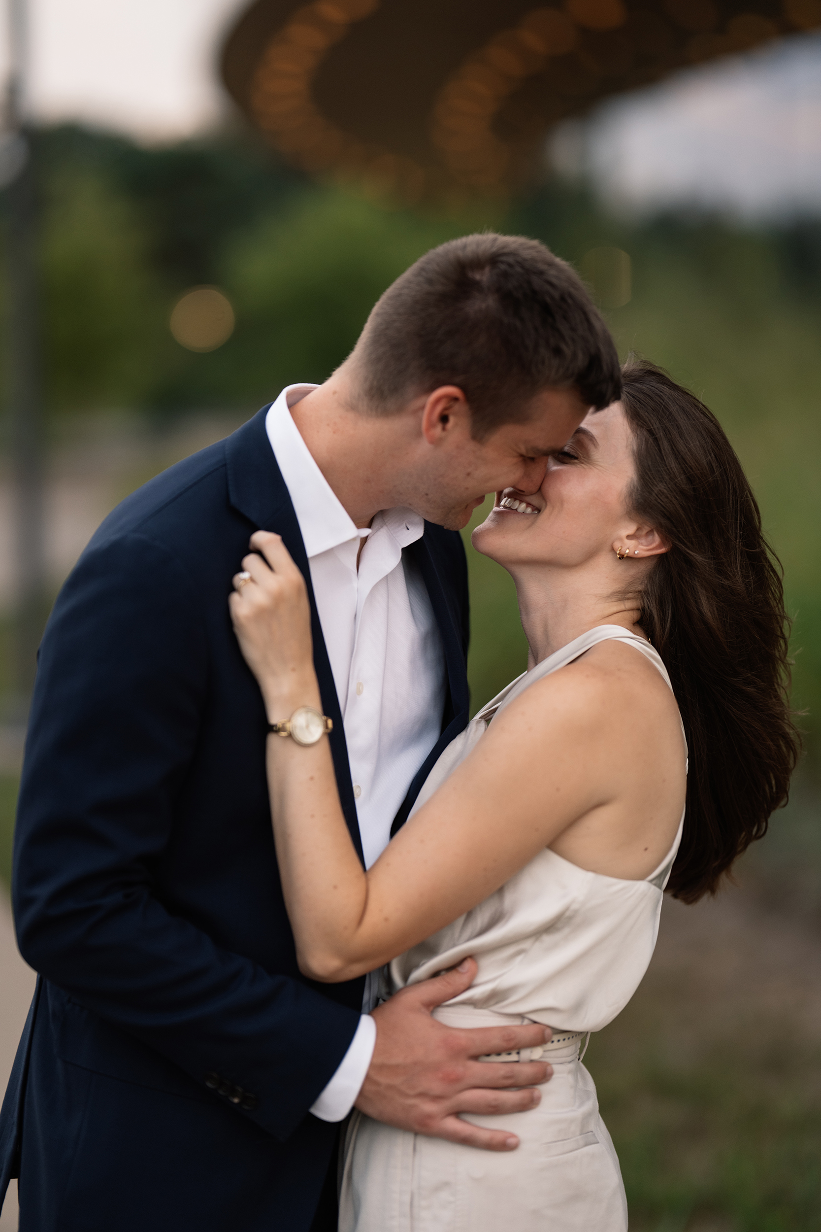 couple under twinkly light wedding arch brick wall olympic south side theater wedding venue cedar rapids