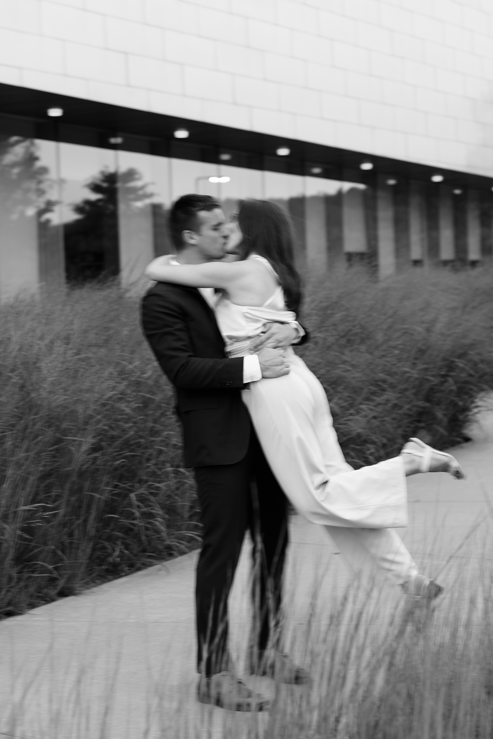 couple under twinkly light wedding arch brick wall olympic south side theater wedding venue cedar rapids