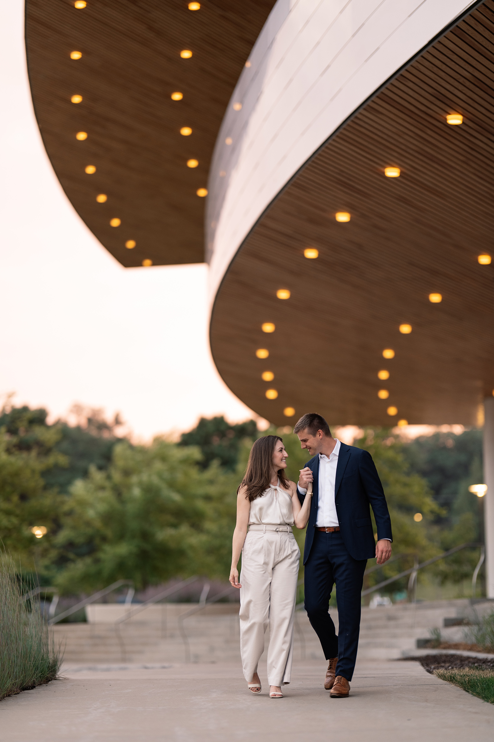 couple under twinkly light wedding arch brick wall olympic south side theater wedding venue cedar rapids