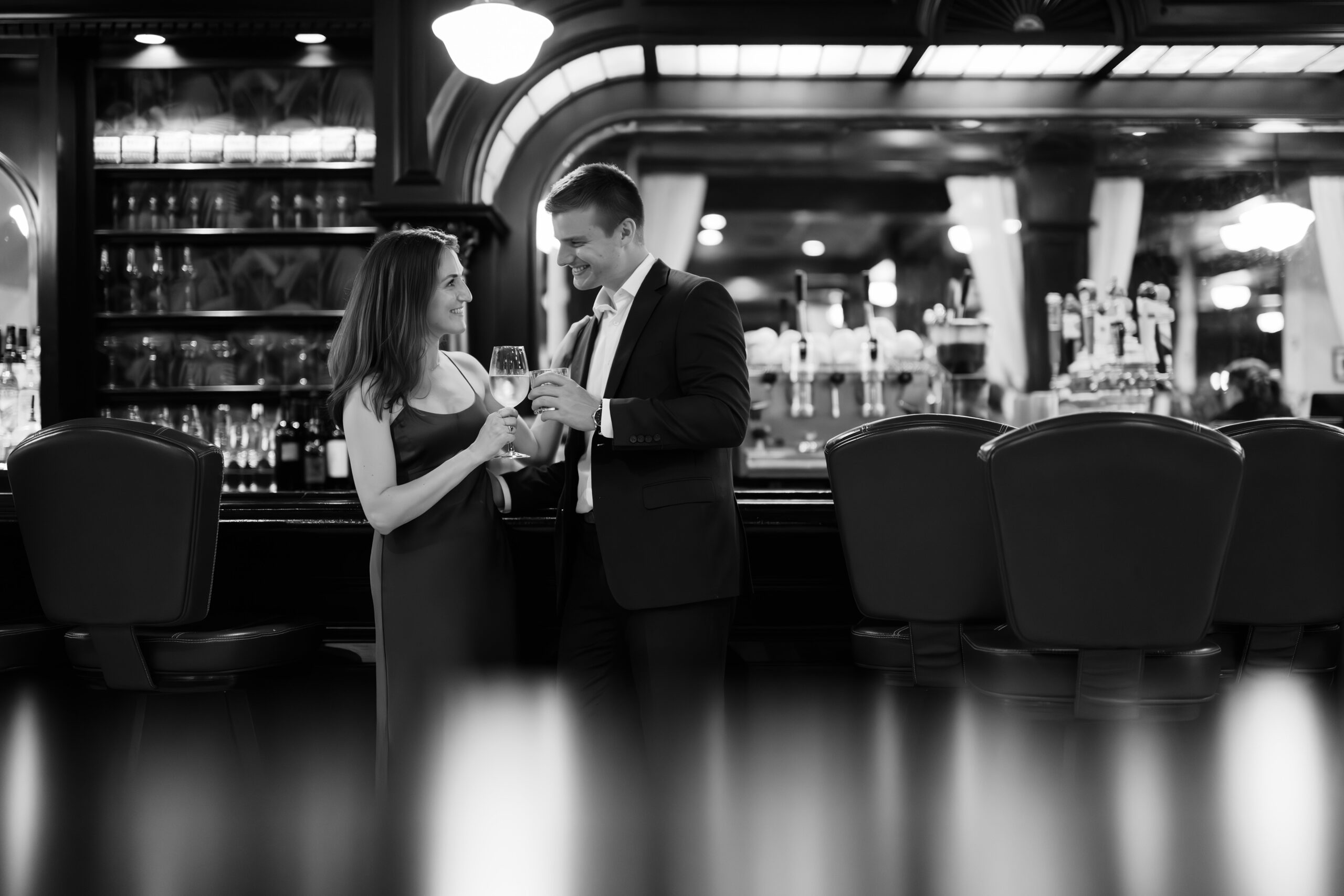 couple under twinkly light wedding arch brick wall olympic south side theater wedding venue cedar rapids