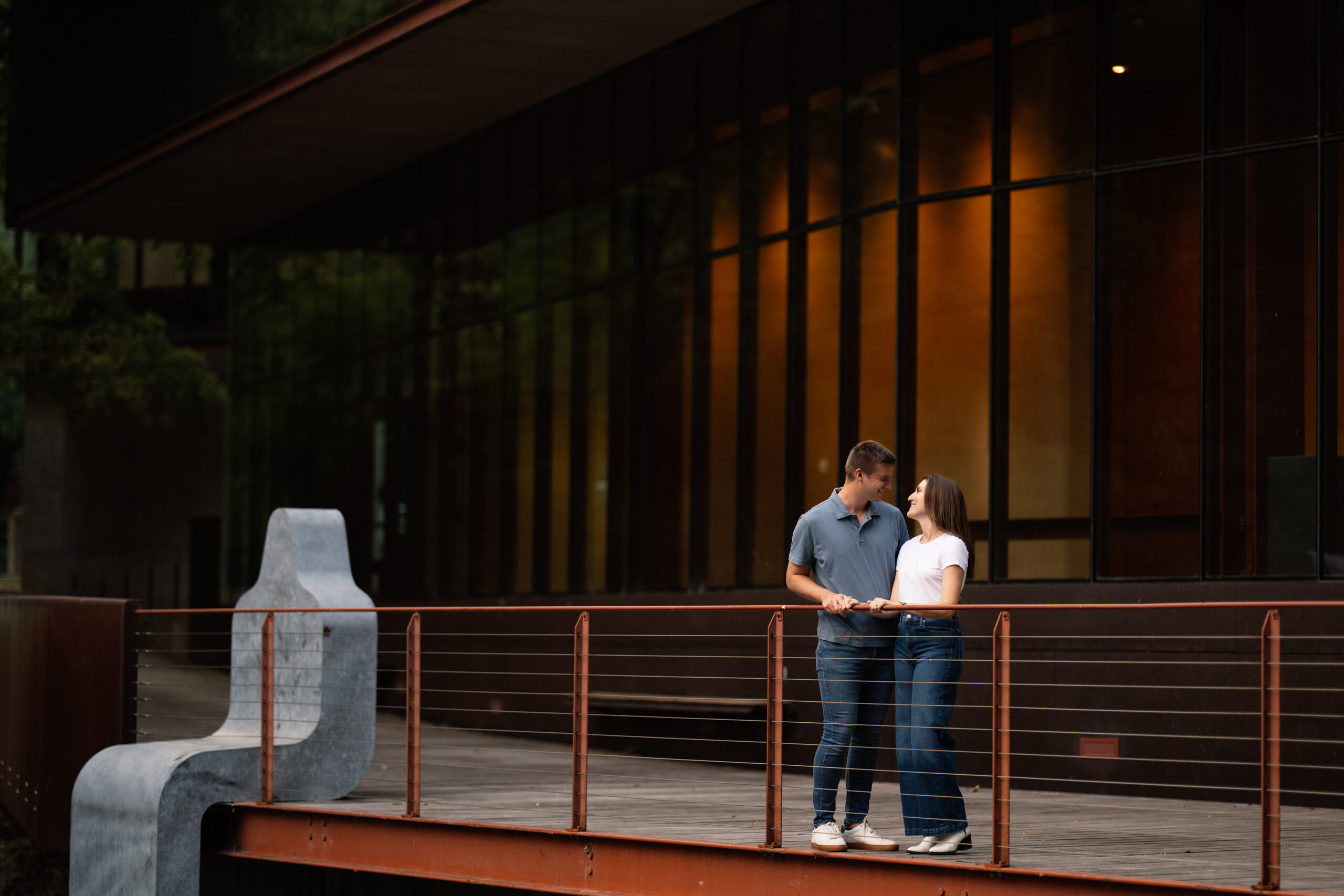 couple under twinkly light wedding arch brick wall olympic south side theater wedding venue cedar rapids