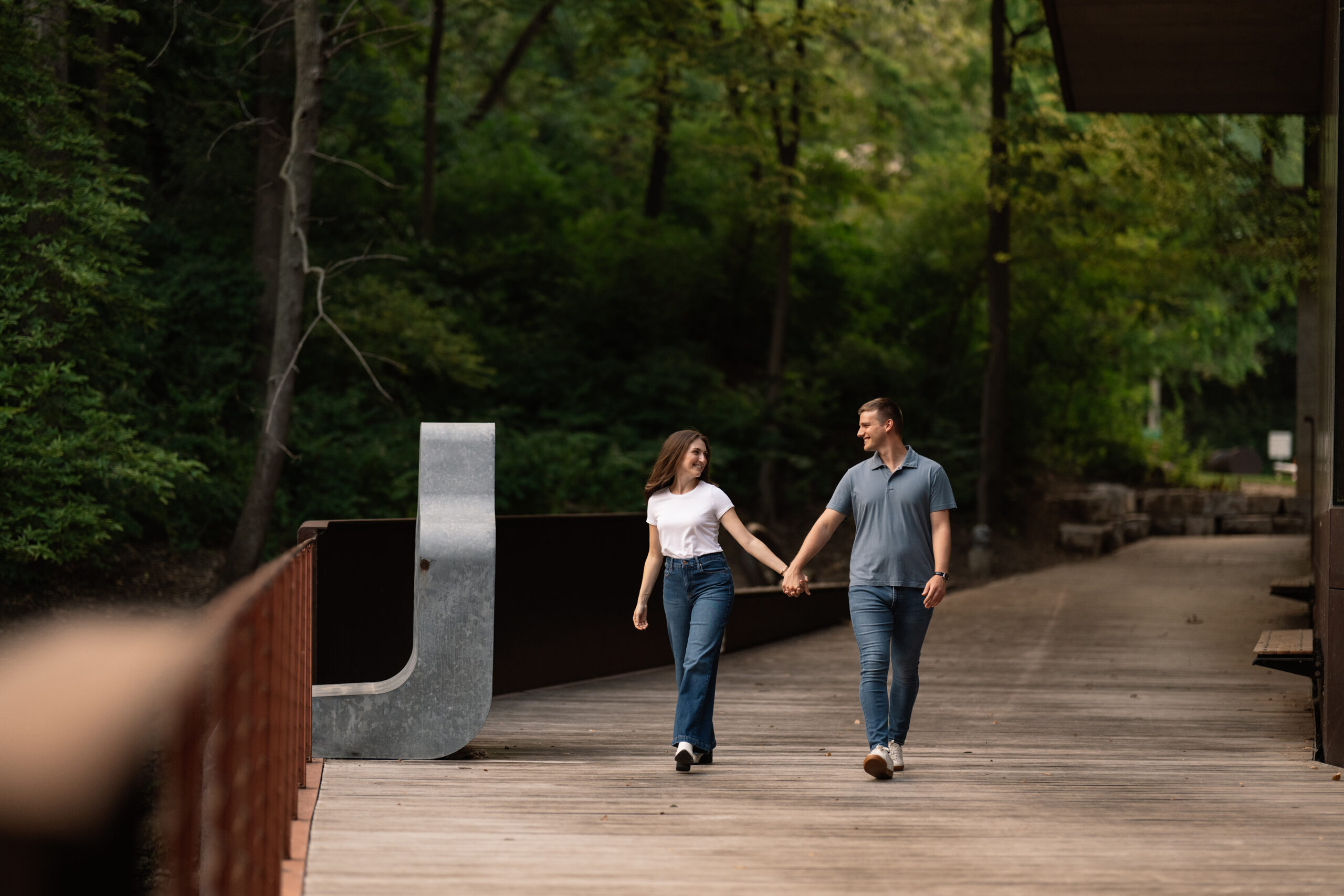 couple under twinkly light wedding arch brick wall olympic south side theater wedding venue cedar rapids