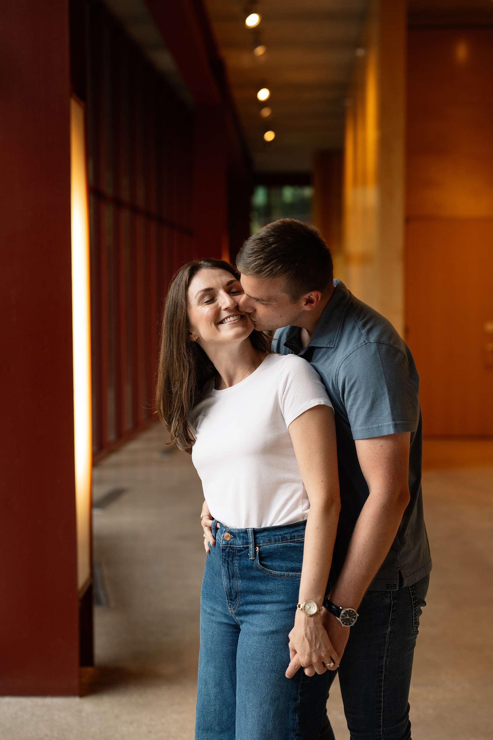 couple under twinkly light wedding arch brick wall olympic south side theater wedding venue cedar rapids