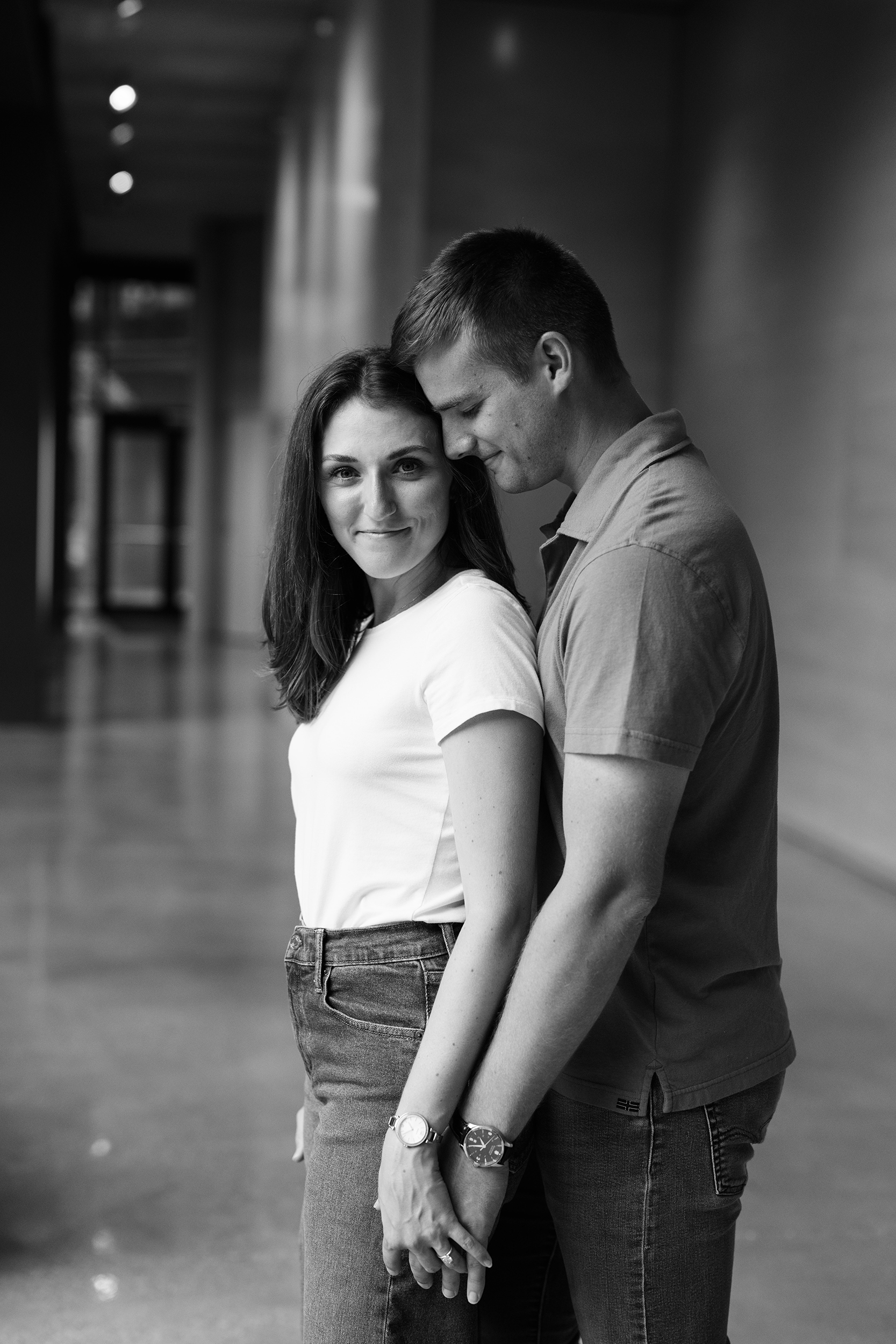 couple under twinkly light wedding arch brick wall olympic south side theater wedding venue cedar rapids