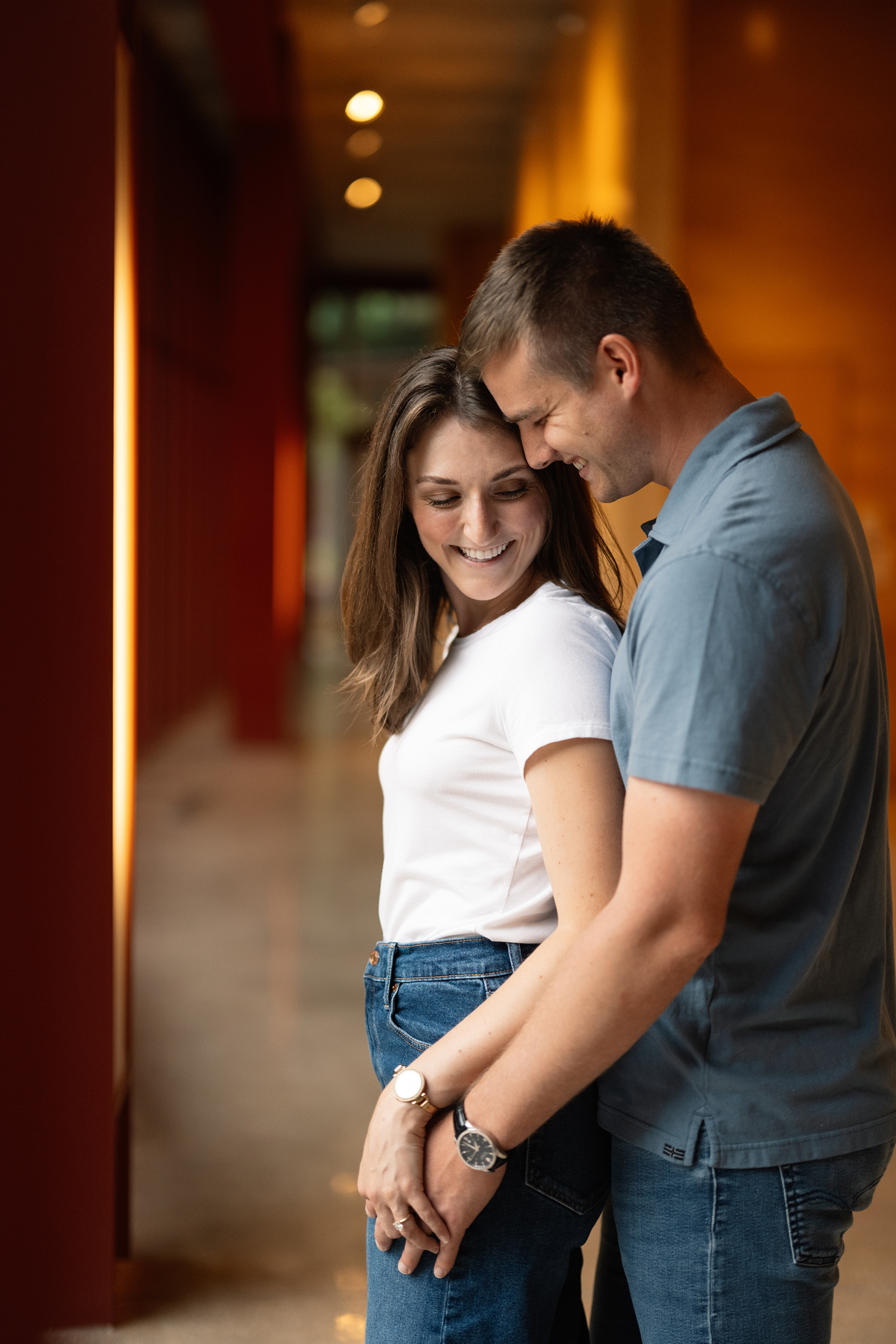 couple under twinkly light wedding arch brick wall olympic south side theater wedding venue cedar rapids