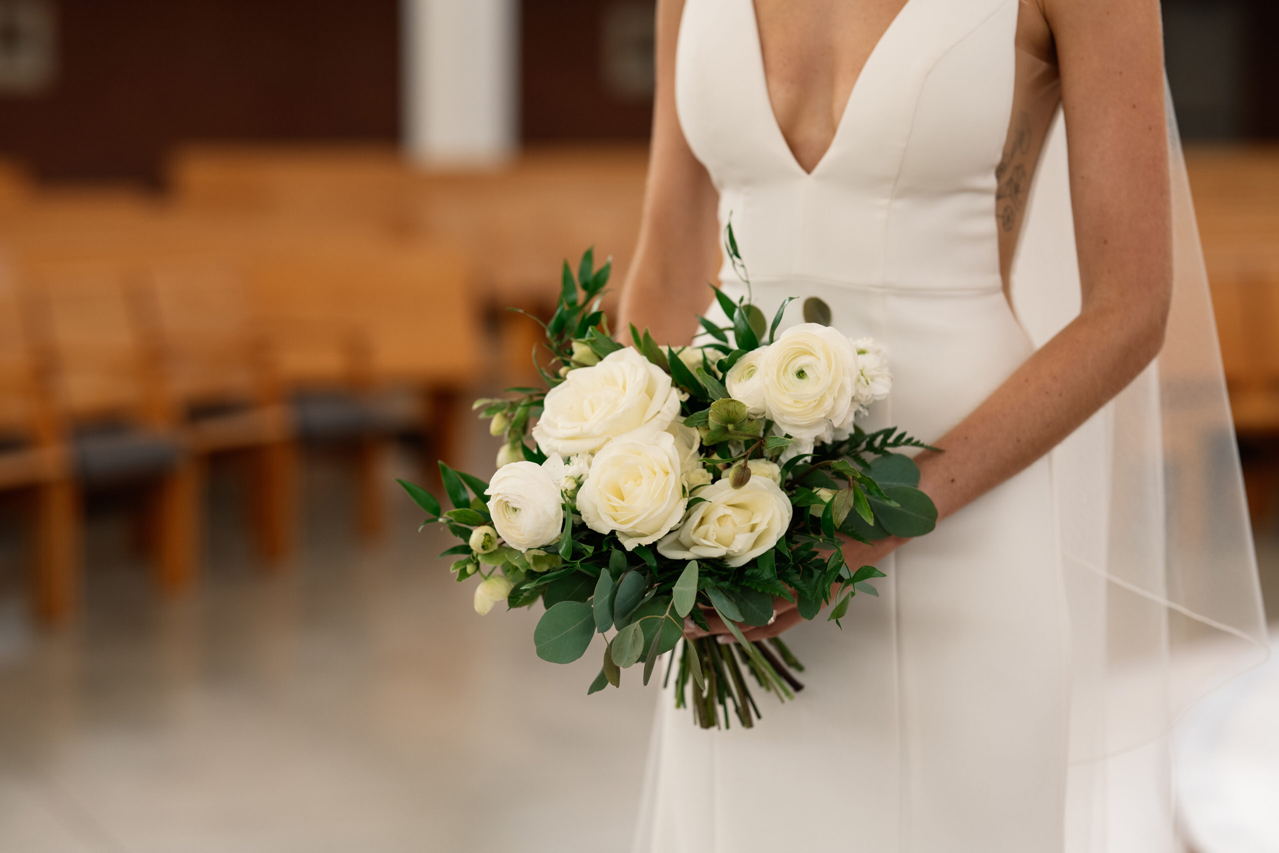 red and pink floral bouquet olympic south side theater wedding venue cedar rapids