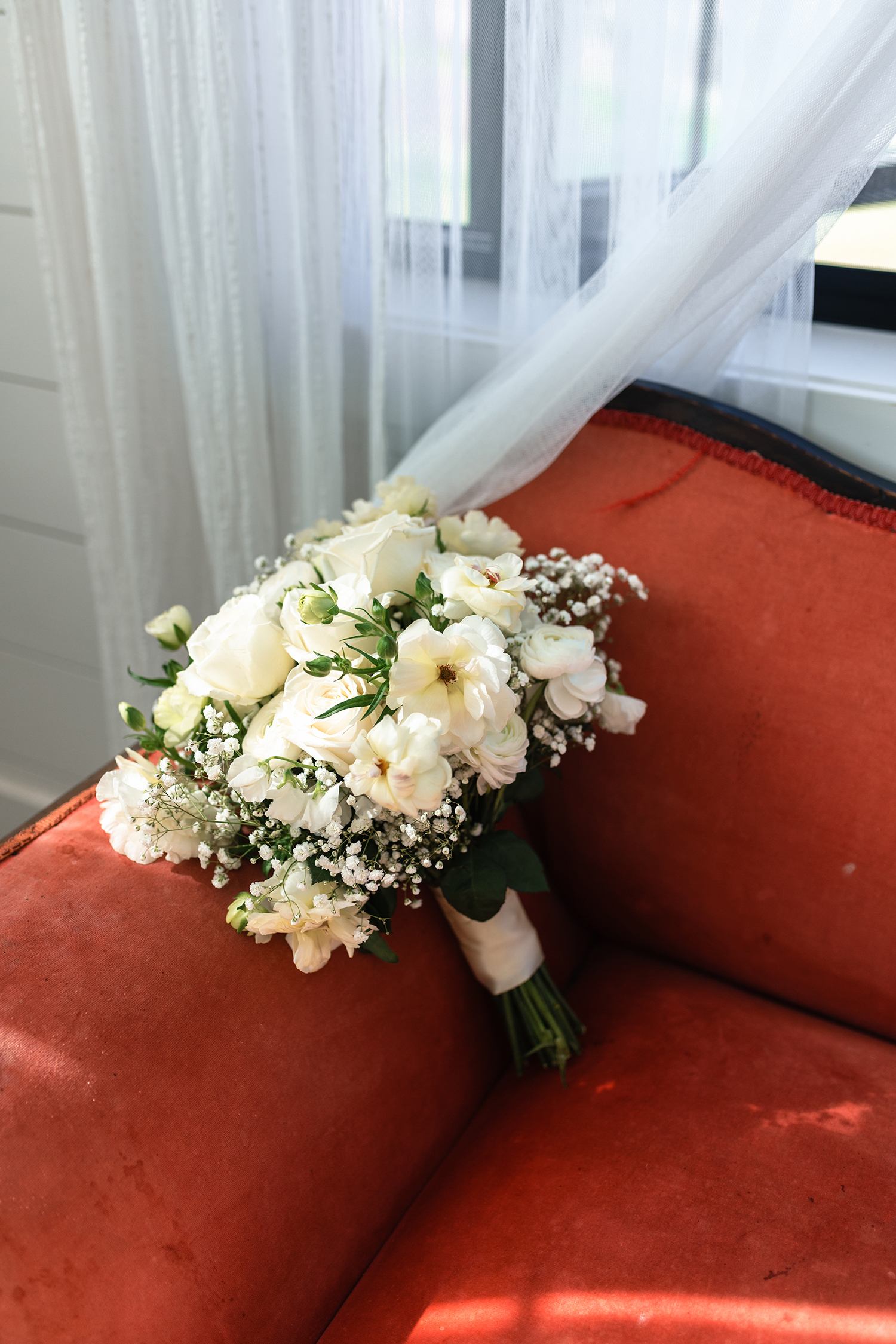 red and pink floral bouquet olympic south side theater wedding venue cedar rapids